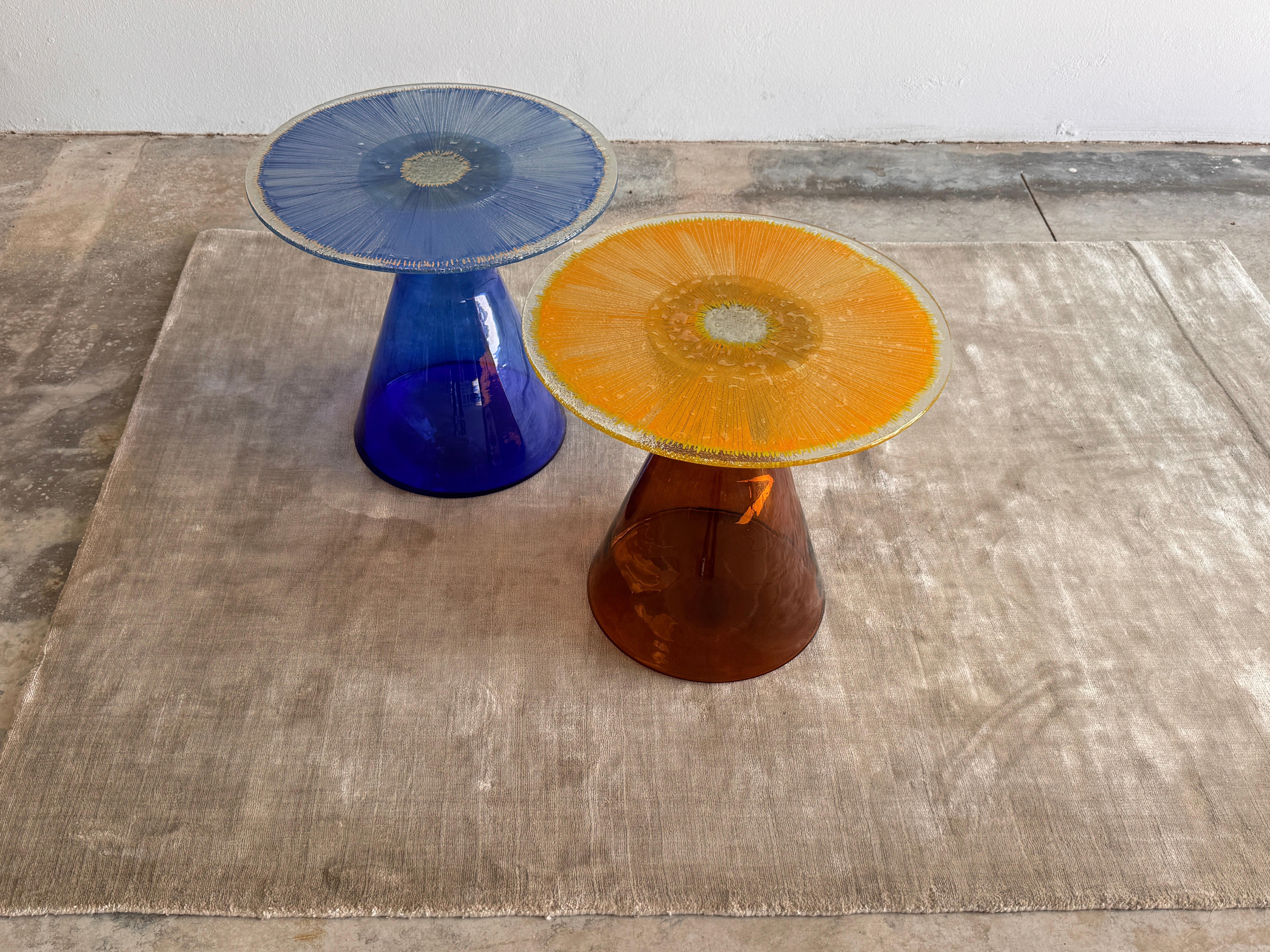 Solastra. 2025
Handcrafted at Jonathan Amar Studio – Portugal

Solastra is a sculptural side table combining ancestral craftsmanship with contemporary design. The base is shaped using traditional glassblowing techniques, while the top is crafted