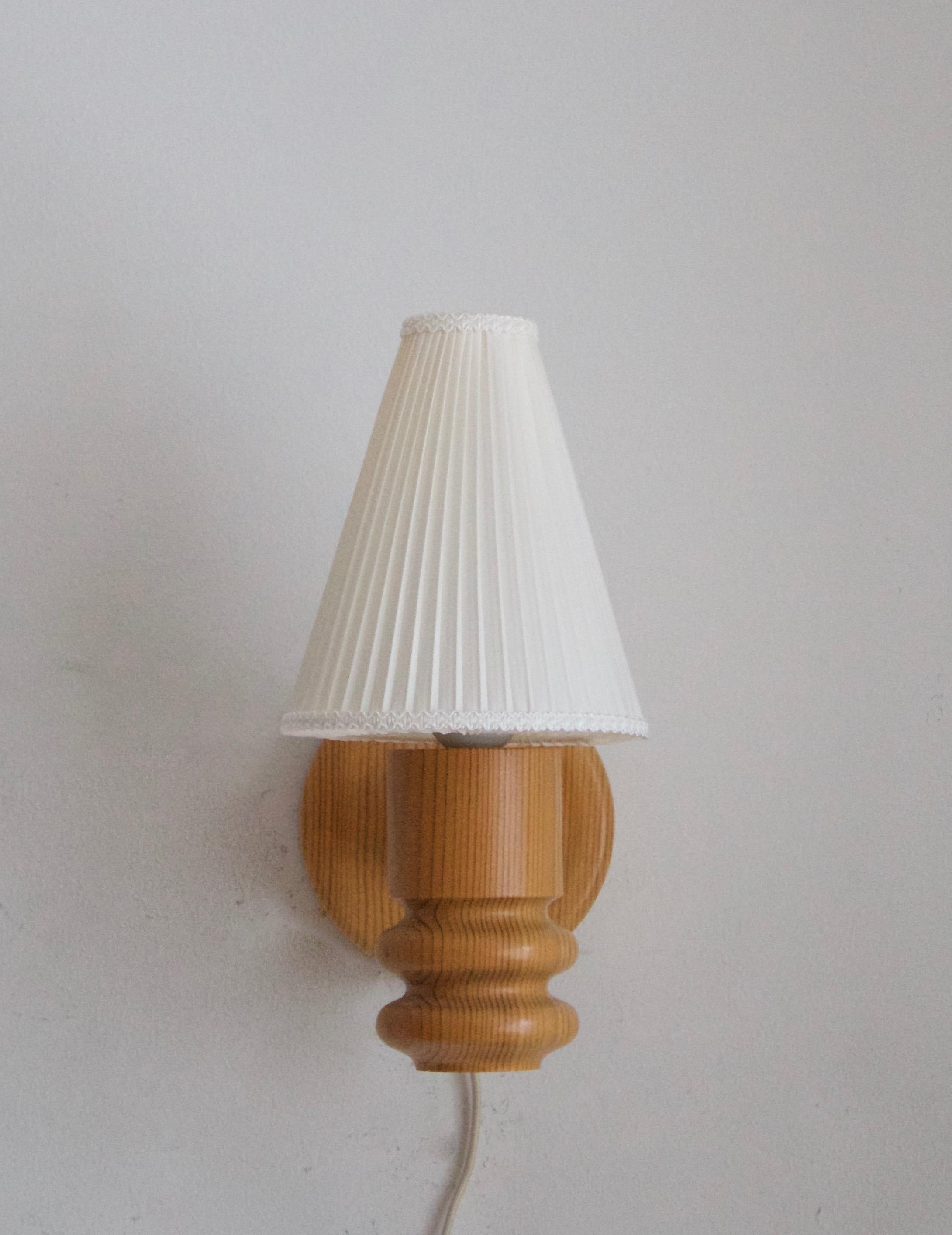Solbackens Svarveri, Minimalist Wall Lights, Turned Pine, Fabric, Sweden, 1970s In Good Condition In High Point, NC