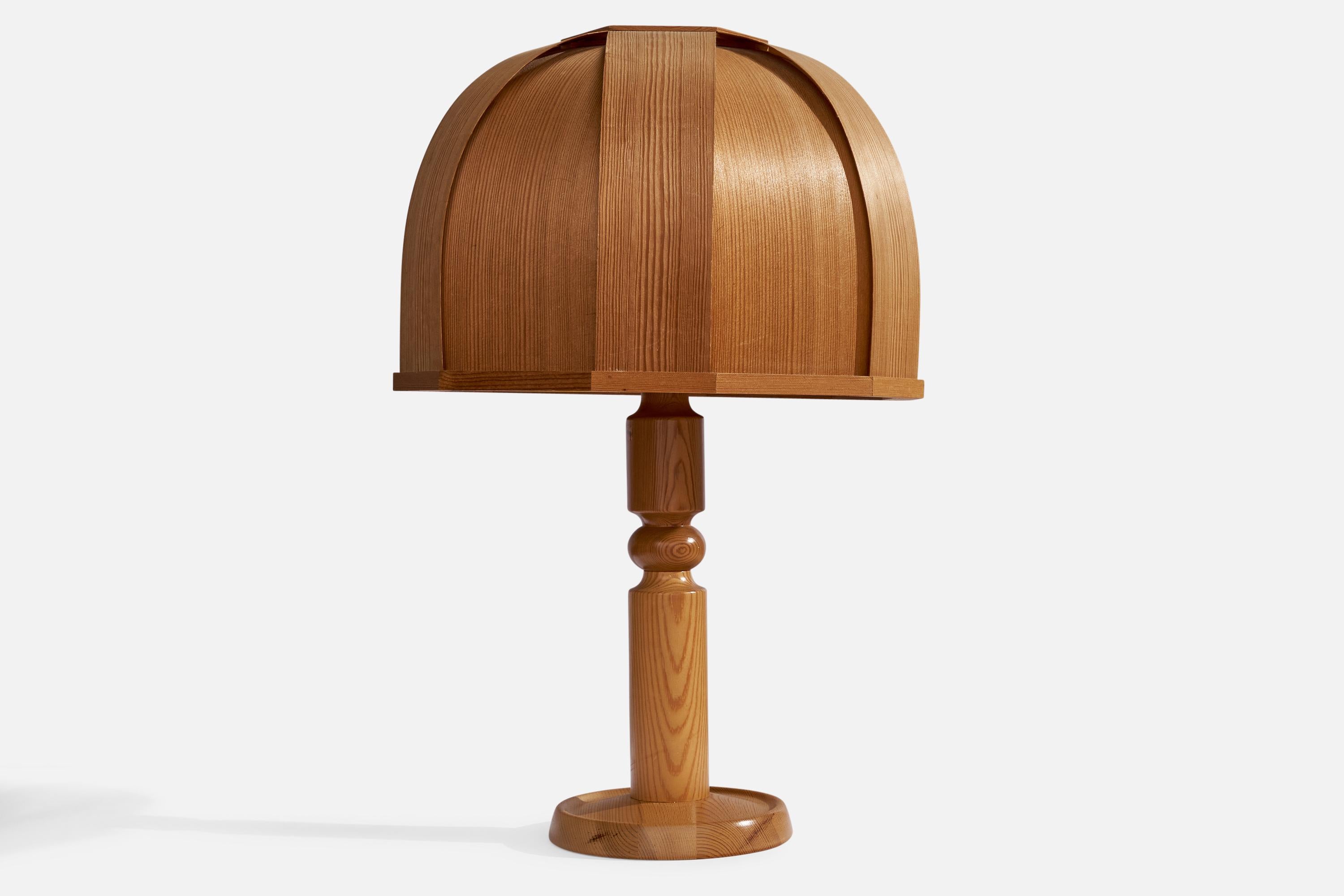A pine and moulded pine veneer table lamp designed and produced by Solbackens Svarveri, Sweden, 1970s.

Overall Dimensions (inches): 24.5”  H x 15.5”  W x 16.5” D
Stated dimensions include shade.
Bulb Specifications: E-26 Bulb
Number of Sockets: