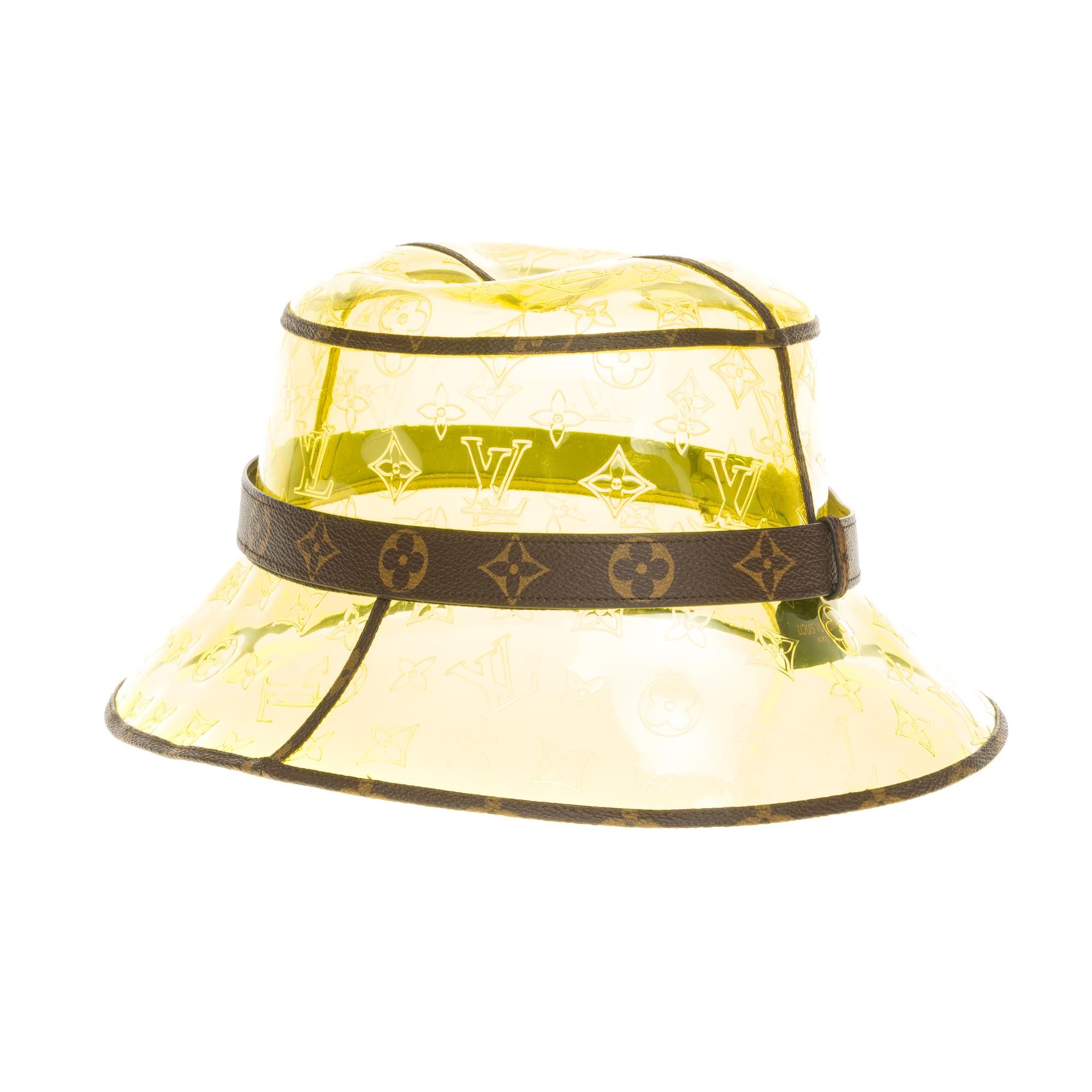 SOLD OUT

Superb and rare Louis Vuitton bi-material hat/Bob in transparent yellow monogram vinyl and monogram canvas, brown stitching will be perfect for your summer days, but also perfect to protect you from the rain
Size : 60
Signature : 