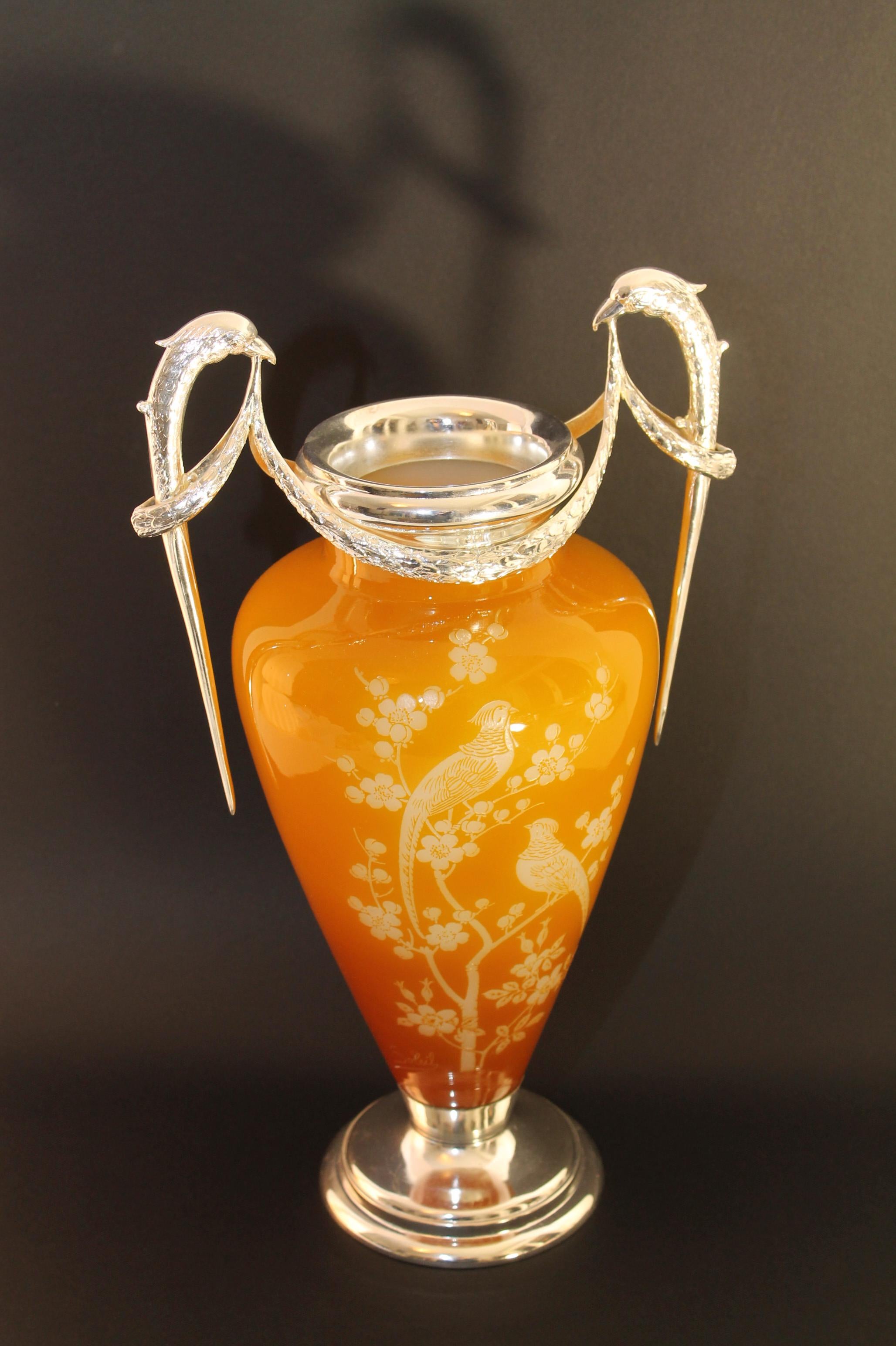 Rare find to come by. Real Eye-catcher!

A soleil silver-mounted cameo glass two-handled vase
Circa 1900
Signed Soleil in cameo, silver mounts/brackets impressed AFC with a crown.
Measurements: ca. 43.5cm (17in ) height x 25cm x