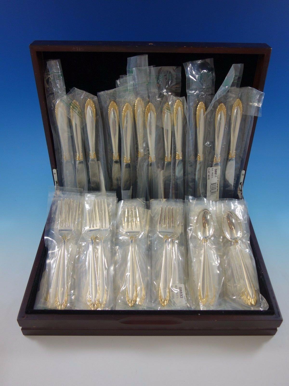 New Soleil gold accent by Lunt, circa 1995, sterling silver flatware set, 48 pieces. This set includes:

12 knives, 9 1/8