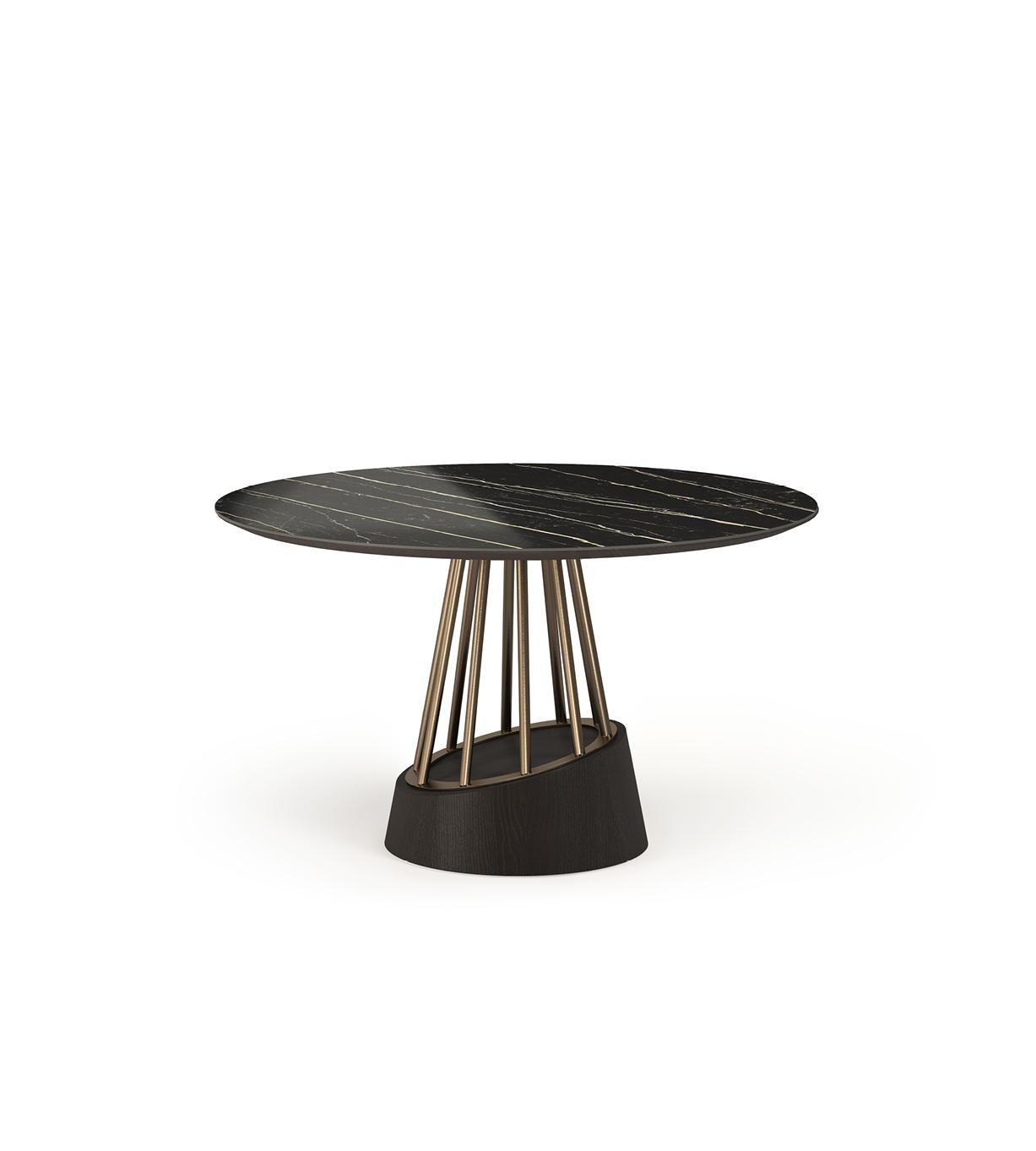 Soleil is an extravagant dining table with a contemporary design. This round dining table features a combination of wood, stainless steel and ceramic.