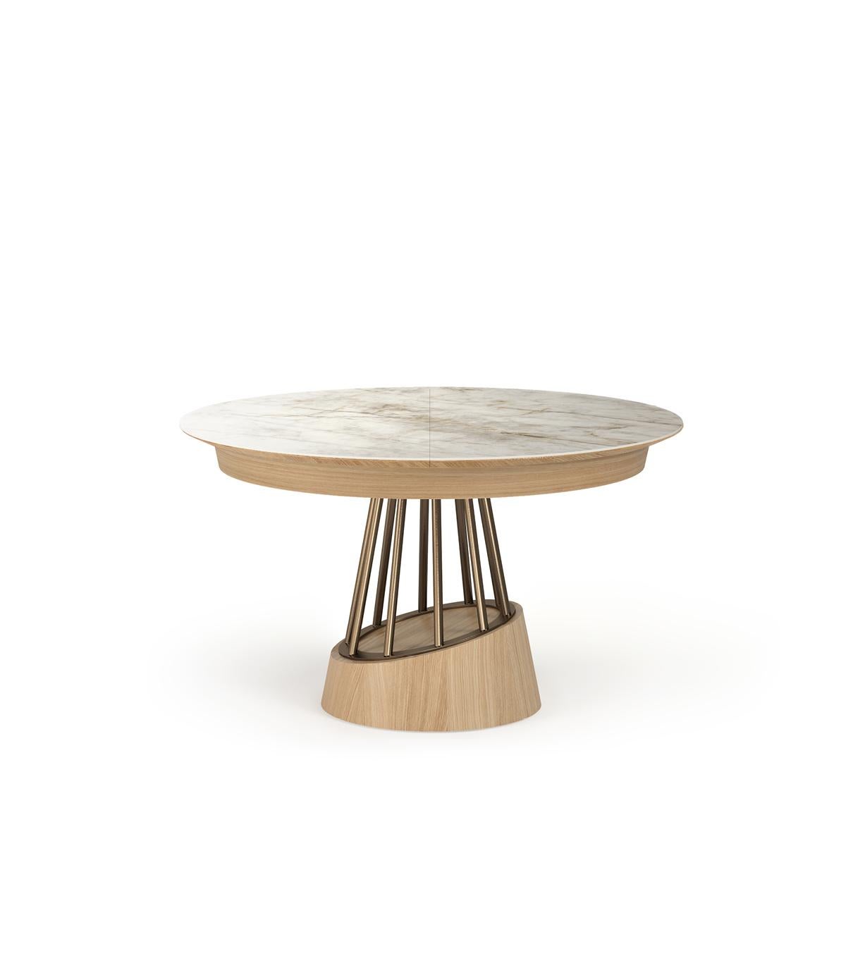 Soleil is an extravagant dining table with a contemporary design. This round, extensible dining table features a combination of wood, stainless steel and ceramic.