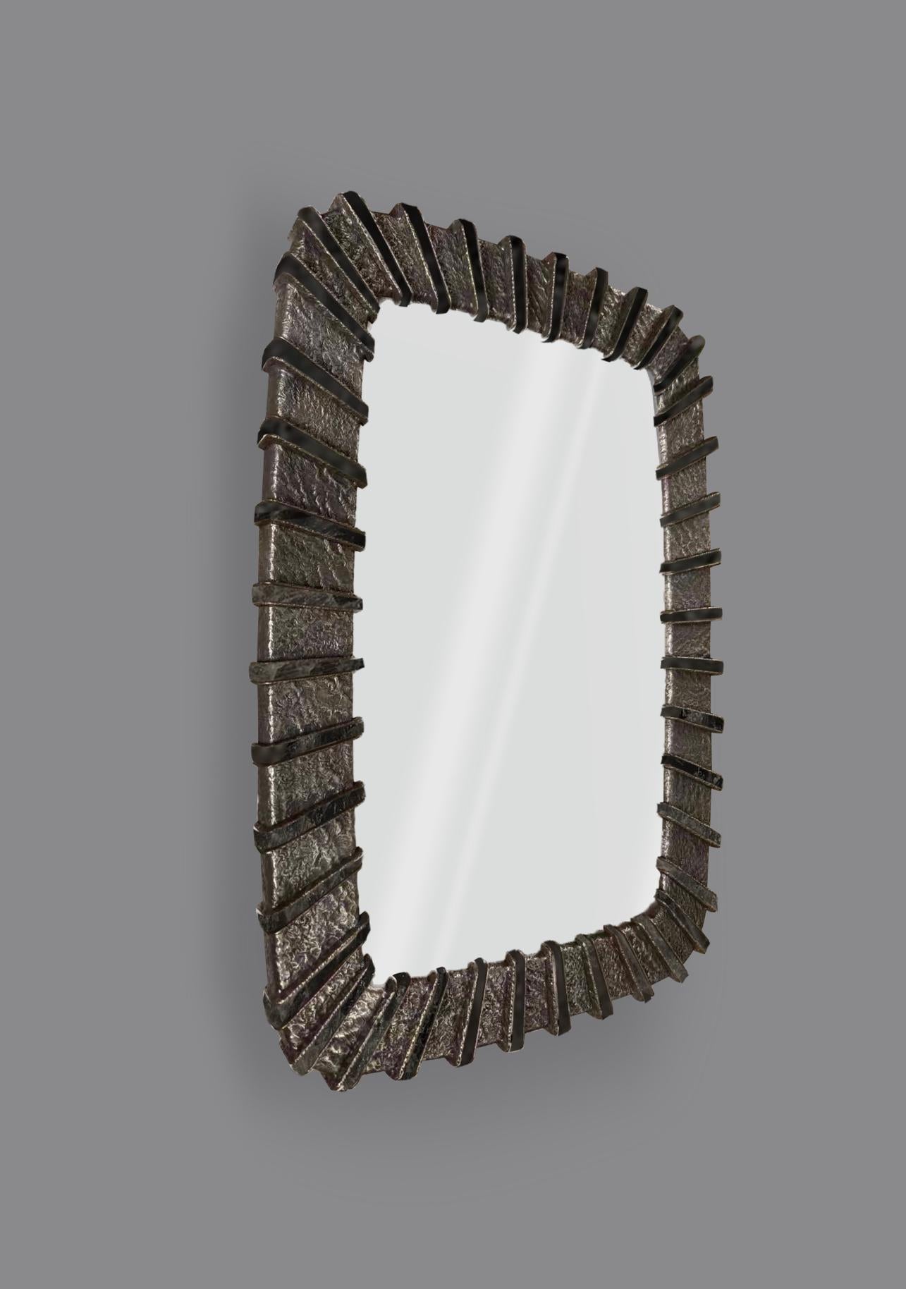 A cushion form mirror with hammered polished brass and blue quartz insert decorations
Created by Phoenix Gallery
custom size and finish upon request.
 