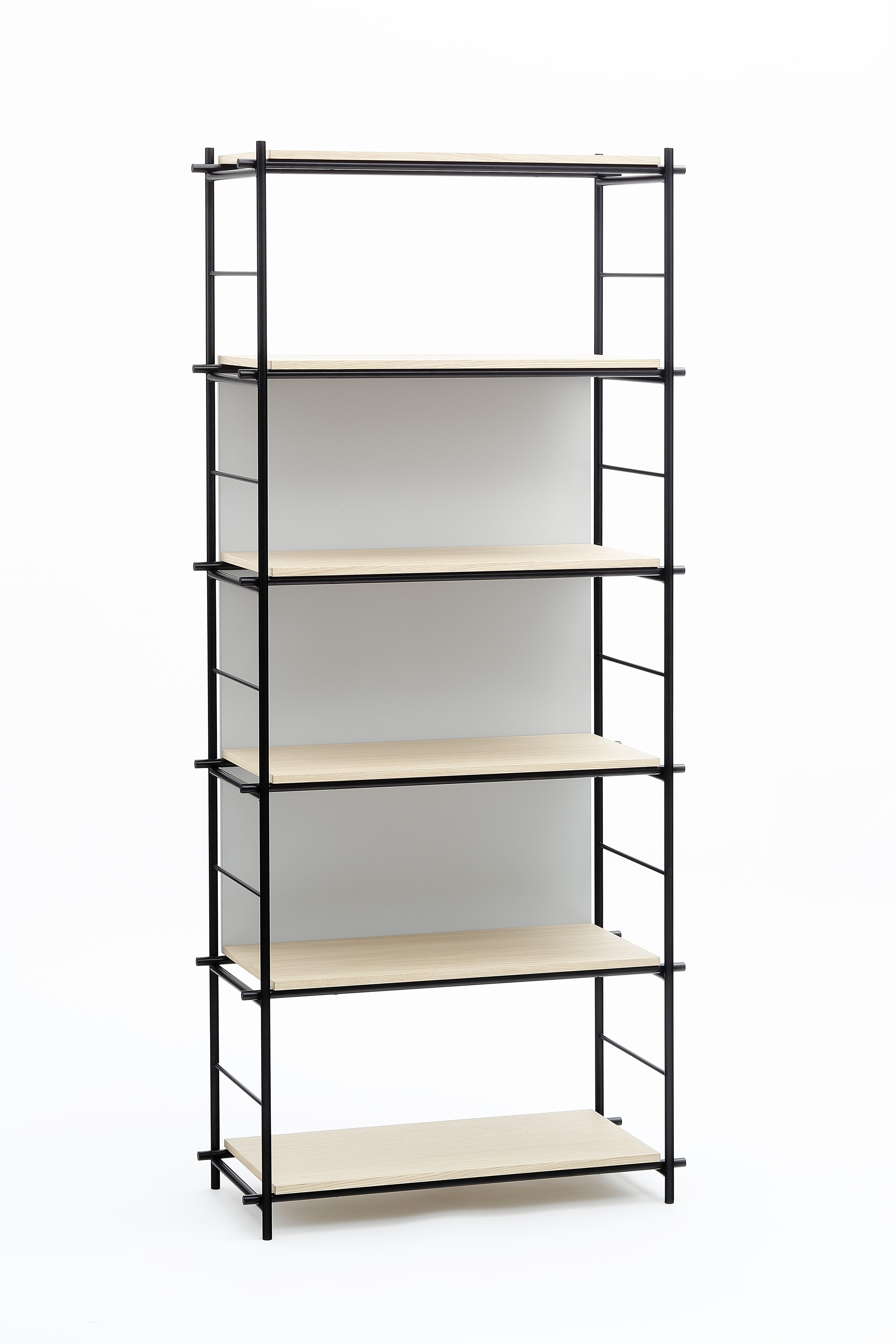 Solferino bookcase by Marcos Zanuso Jr
Materials: Bookcase in matt black epoxy metal. Matt lacquered natural oak veneer shelves Gray lacquered backrest on MDF
Technique: Lacquered metal. 
Dimensions: D 35 x W 80 x H 183 cm


Marco Zanuso JR,