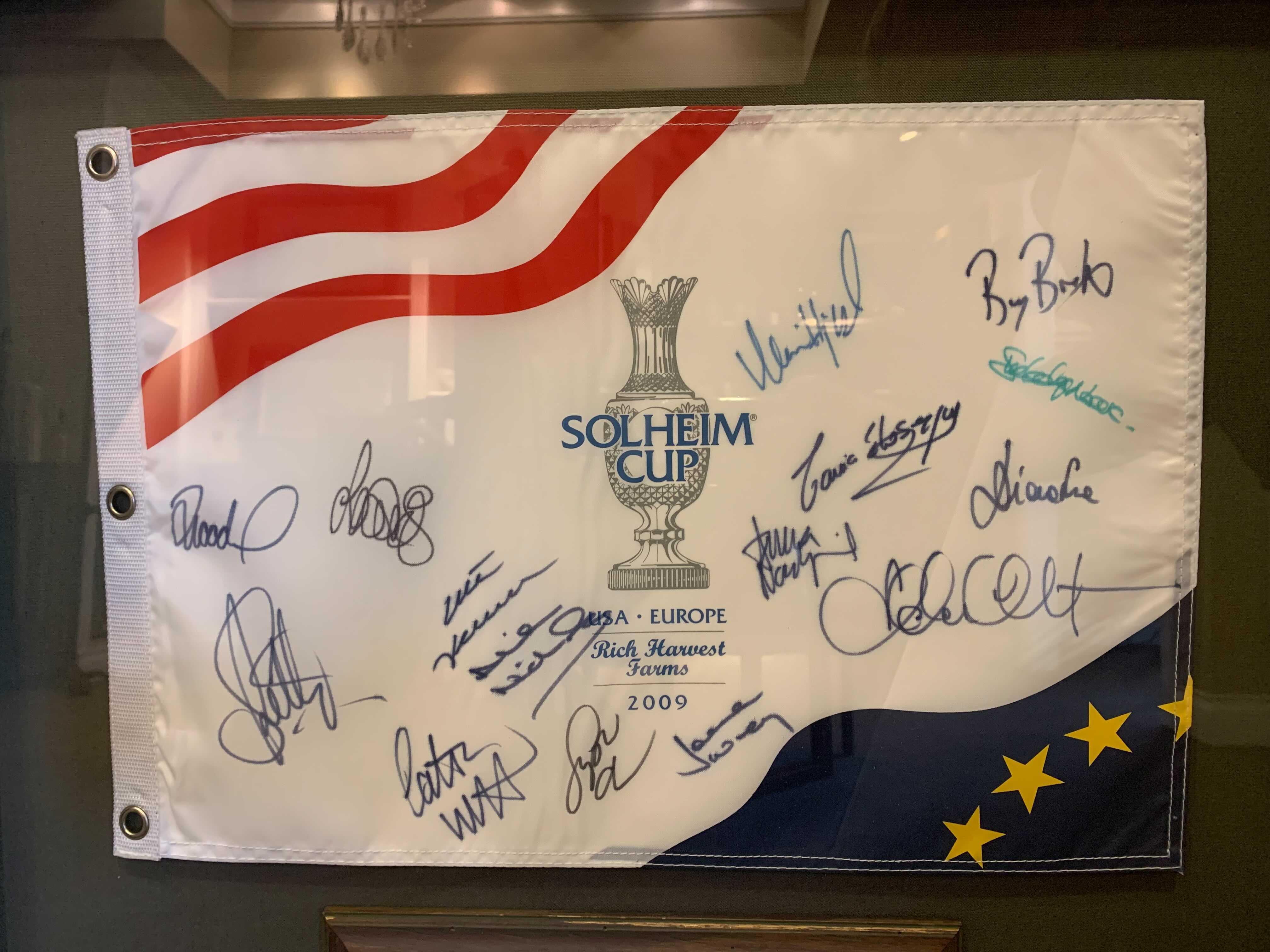 Solheim Cup Matches U.S. & European Team Signed Photo & Flag, USA 16 vs. EUROPE 12, Circa 2009

Presented is an autographed collage celebrating the women golfers of the 2009 Solheim Cup U.S. and European teams. The 11th Solheim Cup Matches were