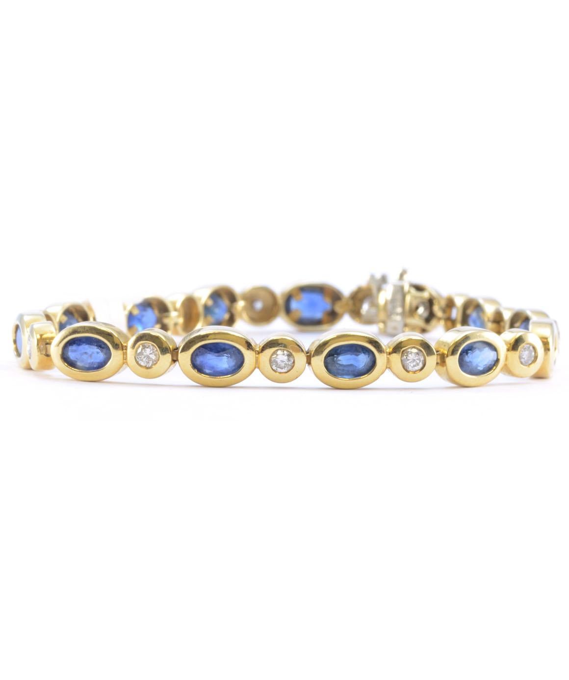 Solid 14K Yellow Gold Genuine Sapphire & Natural Diamond Tennis Bracelet 14.1g
Excellent condition. This 14k yellow gold tennis bracelet features 12 genuine oval sapphires that measure approximately 6mm X 3.9mm. There are 13 genuine round diamonds