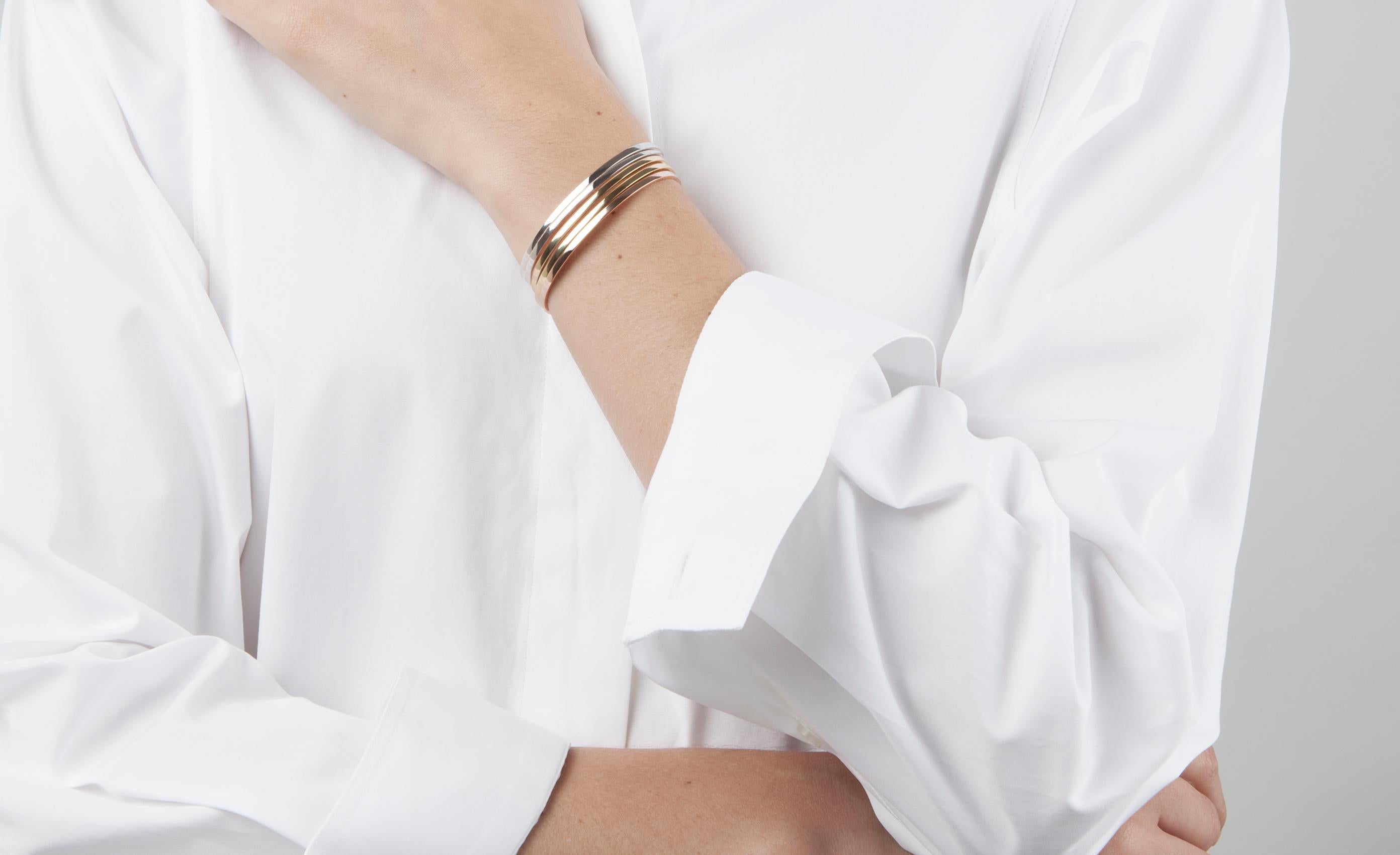 This timeless 14 karat solid white gold bracelet has been designed by Lilian von Trapp in a minimal oval shape. The invisible joint creates a seamless complete form around the wrist for a perfect fit, secured by a small locking mechanism on the