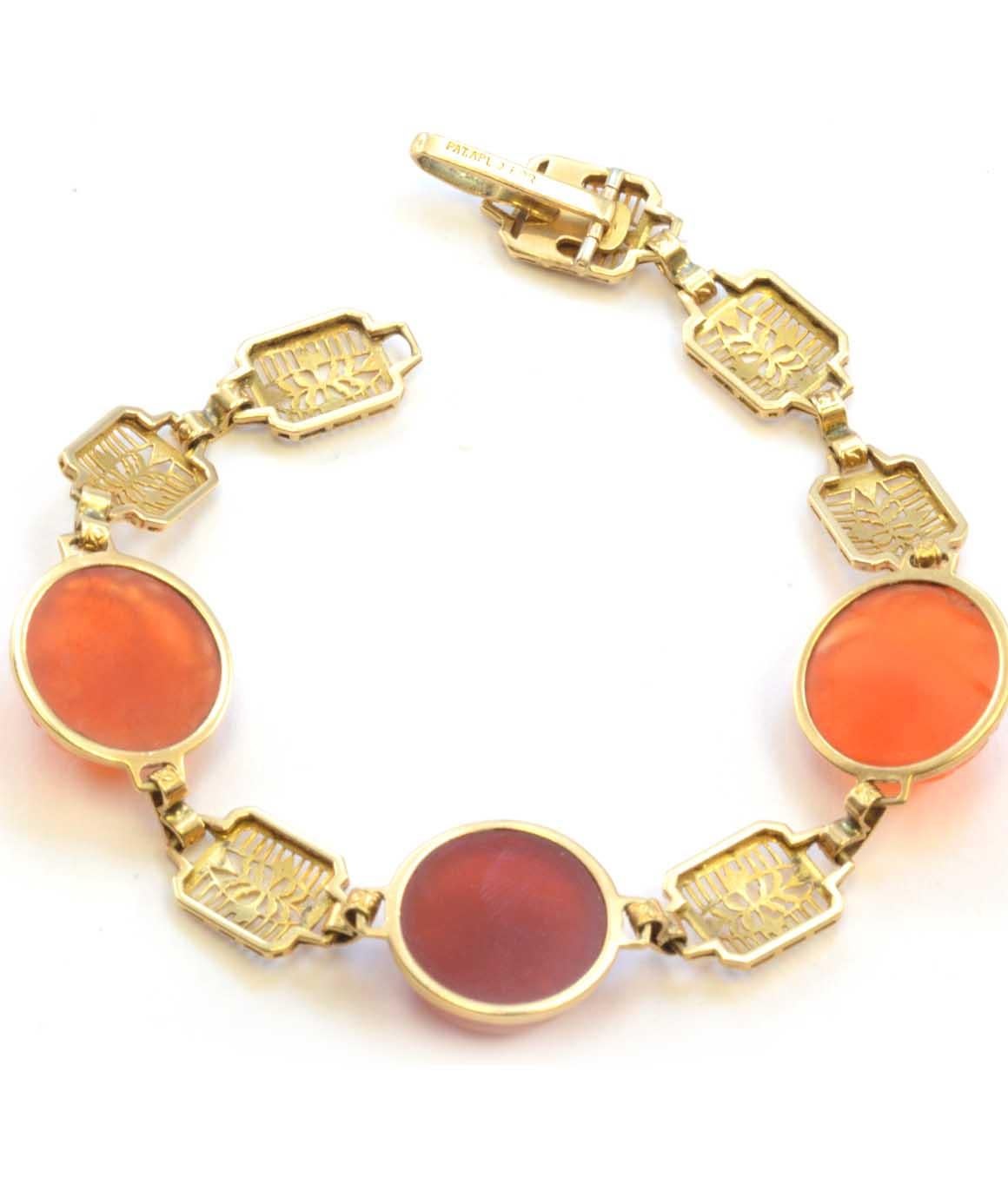 Solid 14K Yellow Gold Cabochon & Carved Genuine Carnelian Bracelet 11.0g
Excellent condition. This solid 14k yellow gold bracelet features 3 genuine carnelian stones,  measuring about 13.57mm. The bracelet measures 7 inches and weighs 11.0 grams.