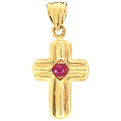Solid 14 Karat Yellow Gold Cross Pendant with a Cabochon Ruby 1.0g