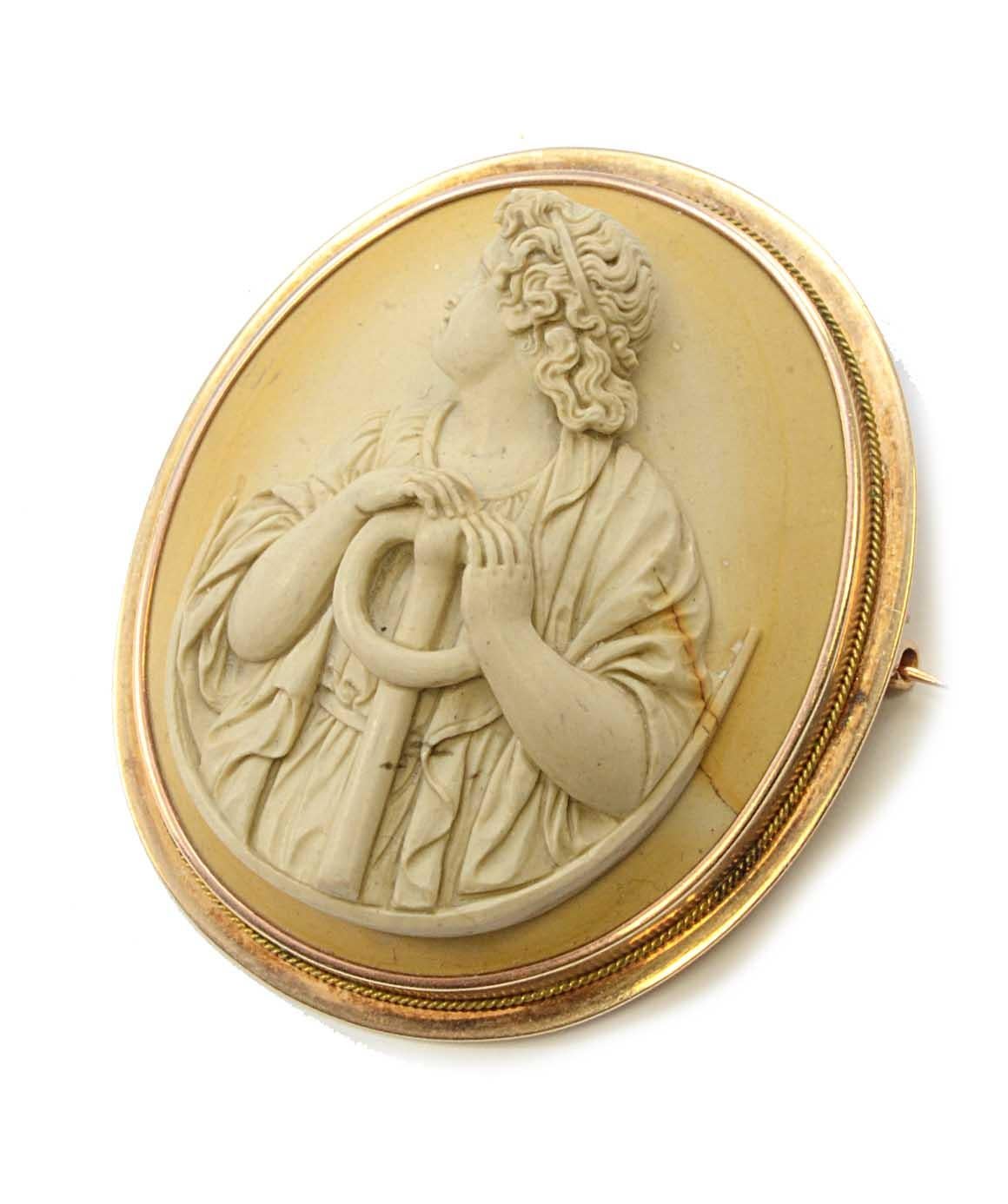 Solid 14K Yellow Gold Lava Cameo Brooch 23.9g Excellent condition! This solid 14k yellow gold cameo is carved from lava. The brooch measures approximately 1.95 inches X 1.75 inches and weighs 23.9 grams. It is open back.