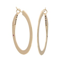 Solid, 14 Karat Yellow Gold Slimline Oval Hoop Earrings with Ruby accent
