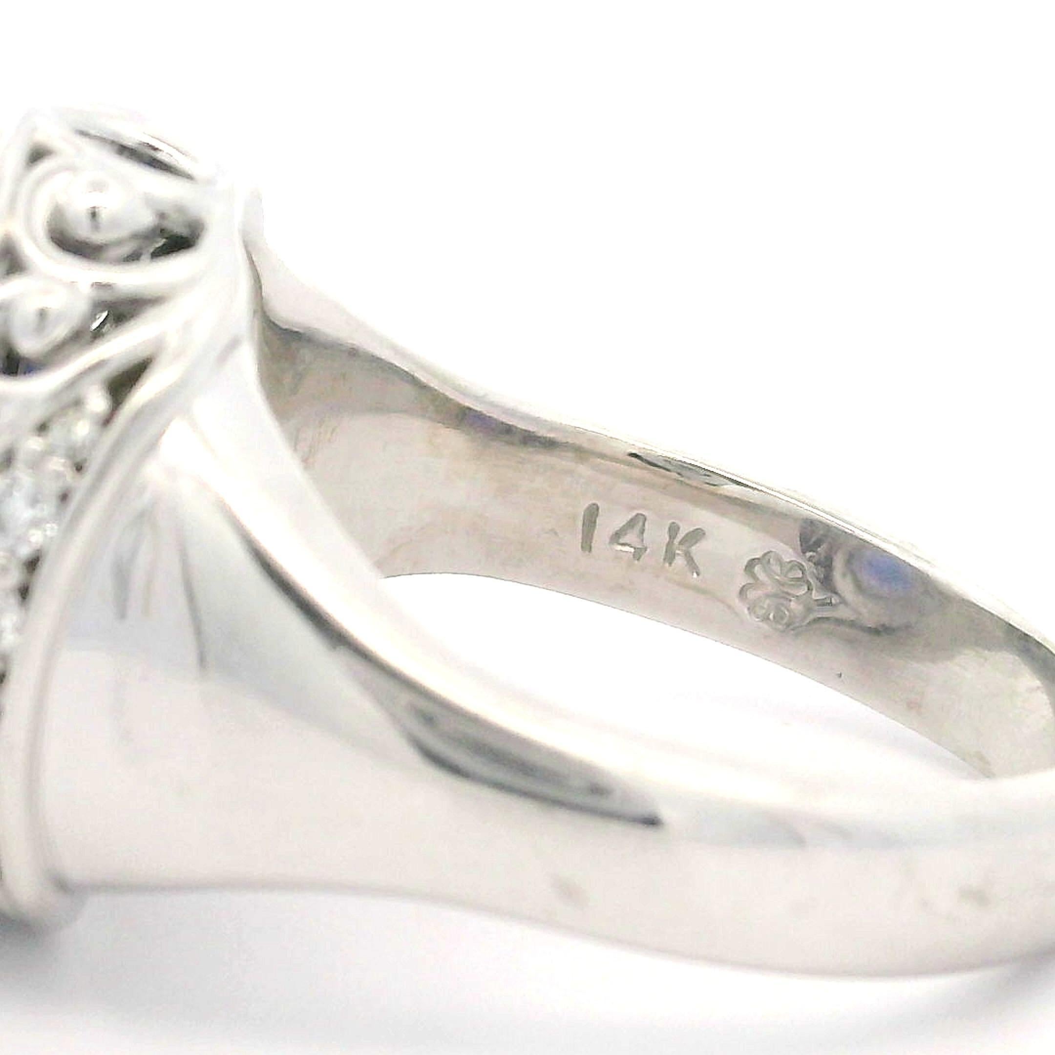 Bague bien faite en or blanc 14 carats avec tanzanite ovale de 4,06 carats et diamants en vente 5