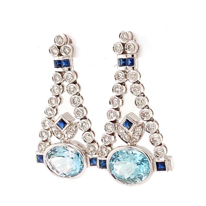 Solid 14K White Gold Genuine Aquamarine, Sapphire & Diamond Chandelier Earrings 
Excellent condition. This pair of solid 14K white gold chandelier earrings feature a natural oval aquamarine set east to west that measures approximately 11.08mm X