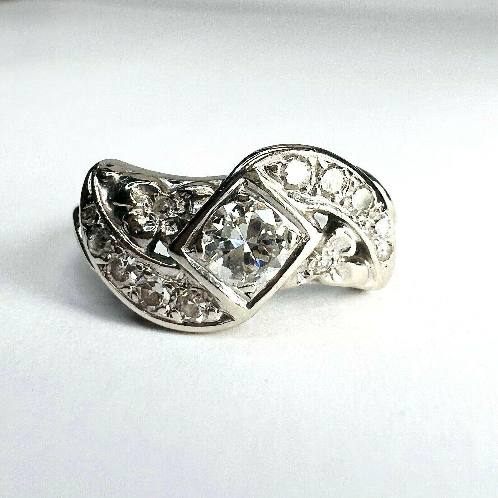 Presenting A:

Solid 14k White Gold Swirl 0.60CTW Diamond Ring Band Size 6.5

This Art Deco swirl ring is made in 14K White Gold with a .35CT brilliant diamond in the center.

All the diamonds are natural and earth mined. 

The Ring is 9mm wide, 4mm