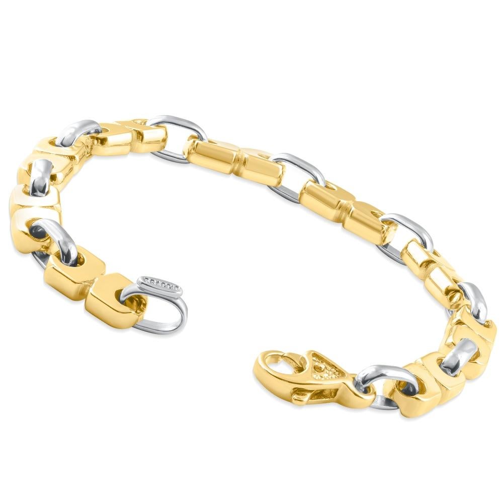 This stunning men's bracelet is made of solid 14k white and yellow gold.  The bracelet weighs 40 grams and measures 8