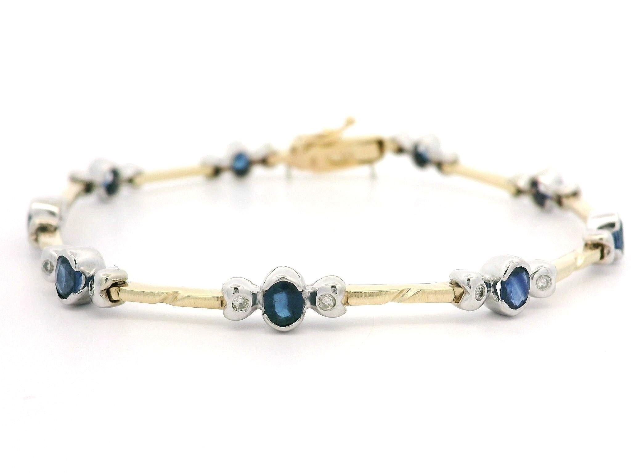 -- Pierre(s) --
(9) Saphirs véritables naturels - taille ovale - demi-biseau en serti clos - couleur bleu moyen - 2,25ctw (approx.)
(18) Diamants naturels authentiques - taille ronde et brillante - sertis - couleur blanche - 0,18ctw (approx.)
Poids