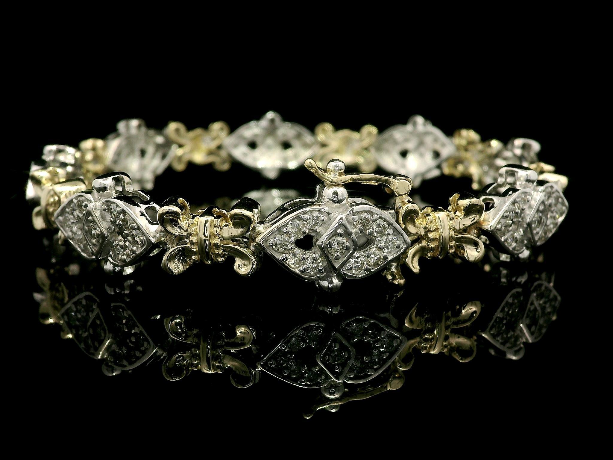 --Stone(s):--
(88) Natural Genuine Diamonds - Round Brilliant Cut - Pave Set - Fiery Nice Brilliant White Color
Total Carat Weight: 2.0 (approx.)

Material: 14K Solid Yellow and White Gold
Weight: 24.04 Grams
Length: 7.5 Inches (next to a ruler) -