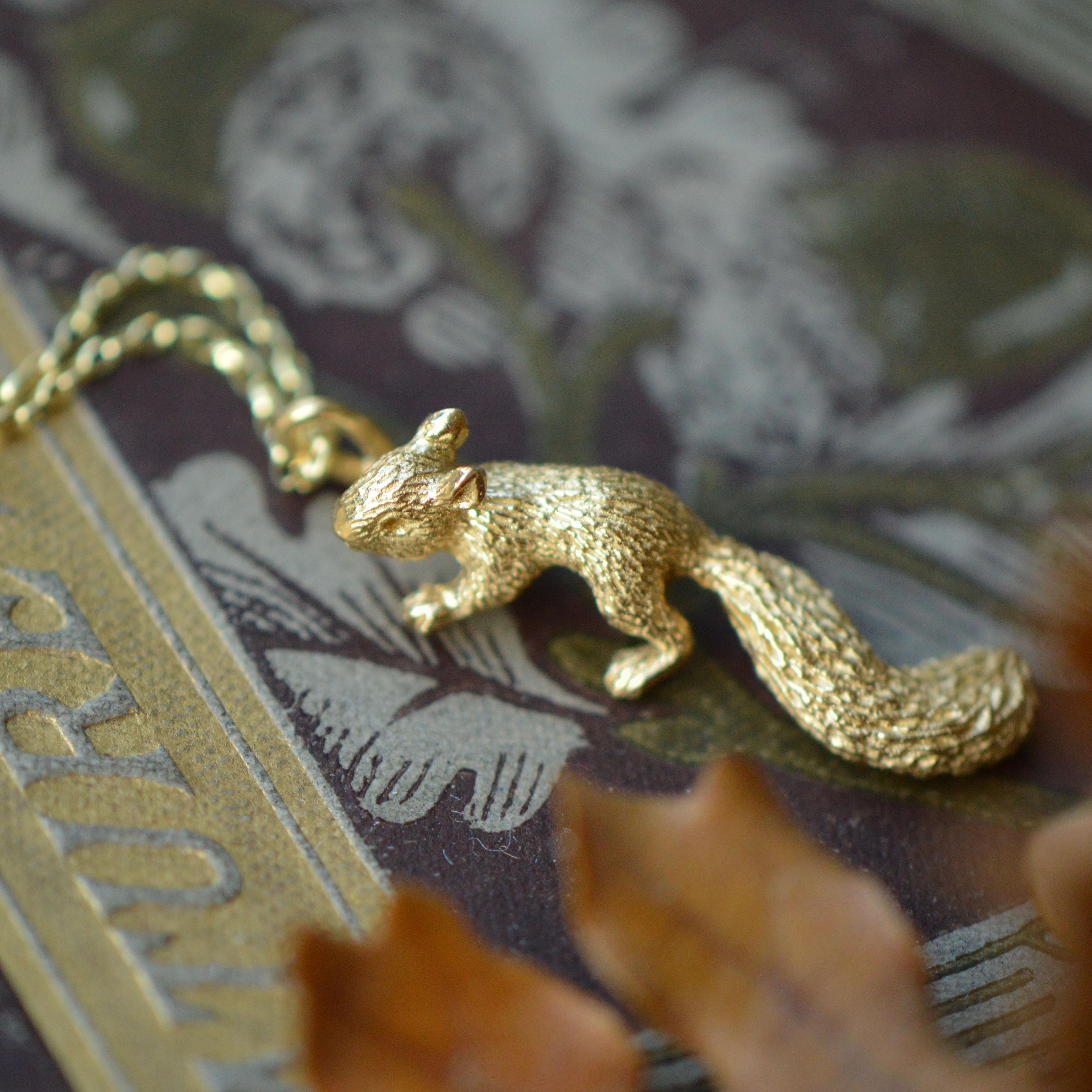 This cute little climbing baby squirrel pendant is cast in solid 18 Carat gold and finished by hand, and is created from Lucy's original hand-sculpted design. 

This whale pendant is made in London, United Kingdom using recycled or Fairtrade Gold.