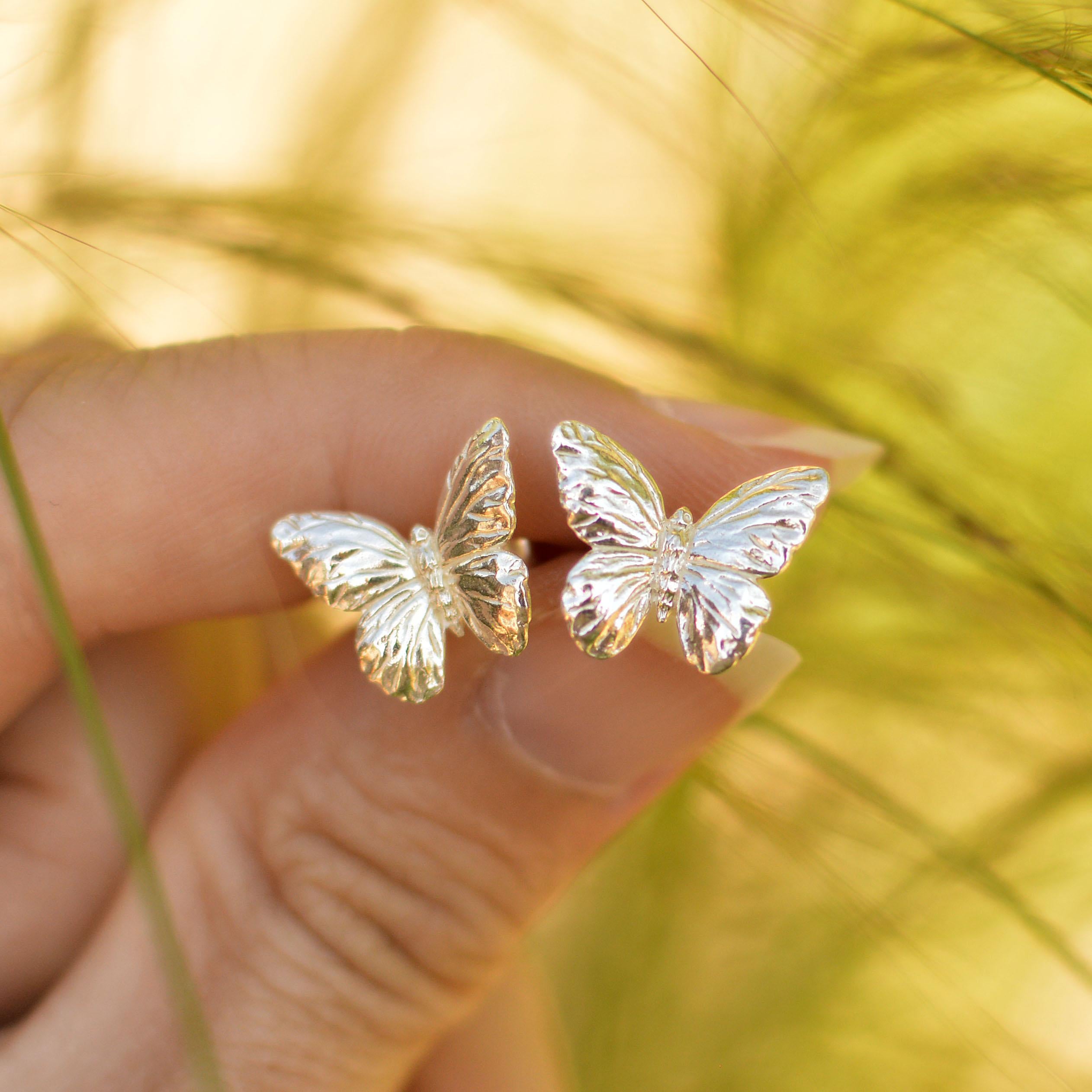 These fluttering butterfly stud earrings are cast in solid 18 Carat gold and finished by hand, and created from Lucy's original hand-sculpted design. 

These butterfly earrings are made in London, United Kingdom using recycled or Fairtrade Gold.