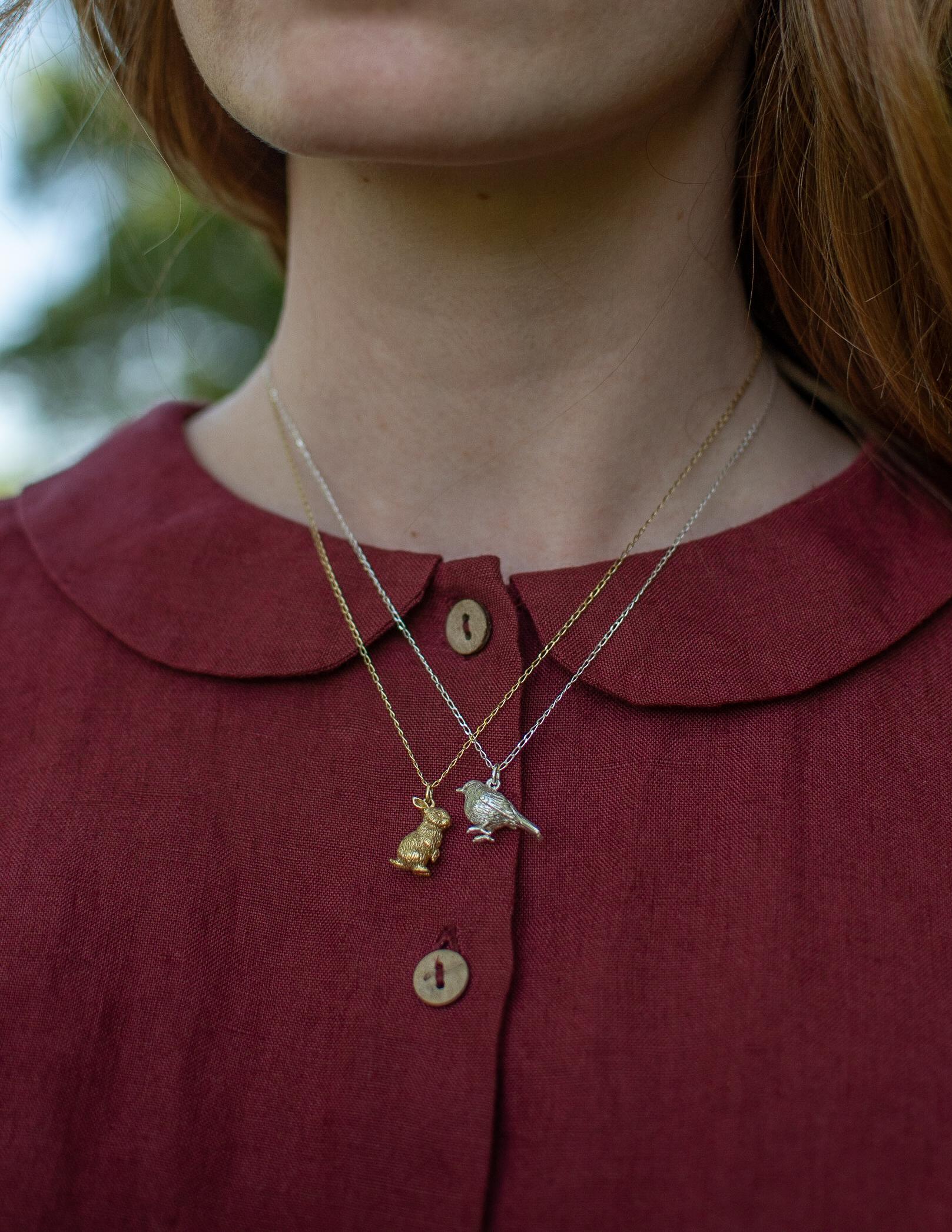 This sweet little robin pendant is cast in solid 18 Carat gold and finished by hand, and is created from Lucy's original hand-sculpted design. 

This robin pendant is made in London, United Kingdom using recycled or Fairtrade Gold. Metals are