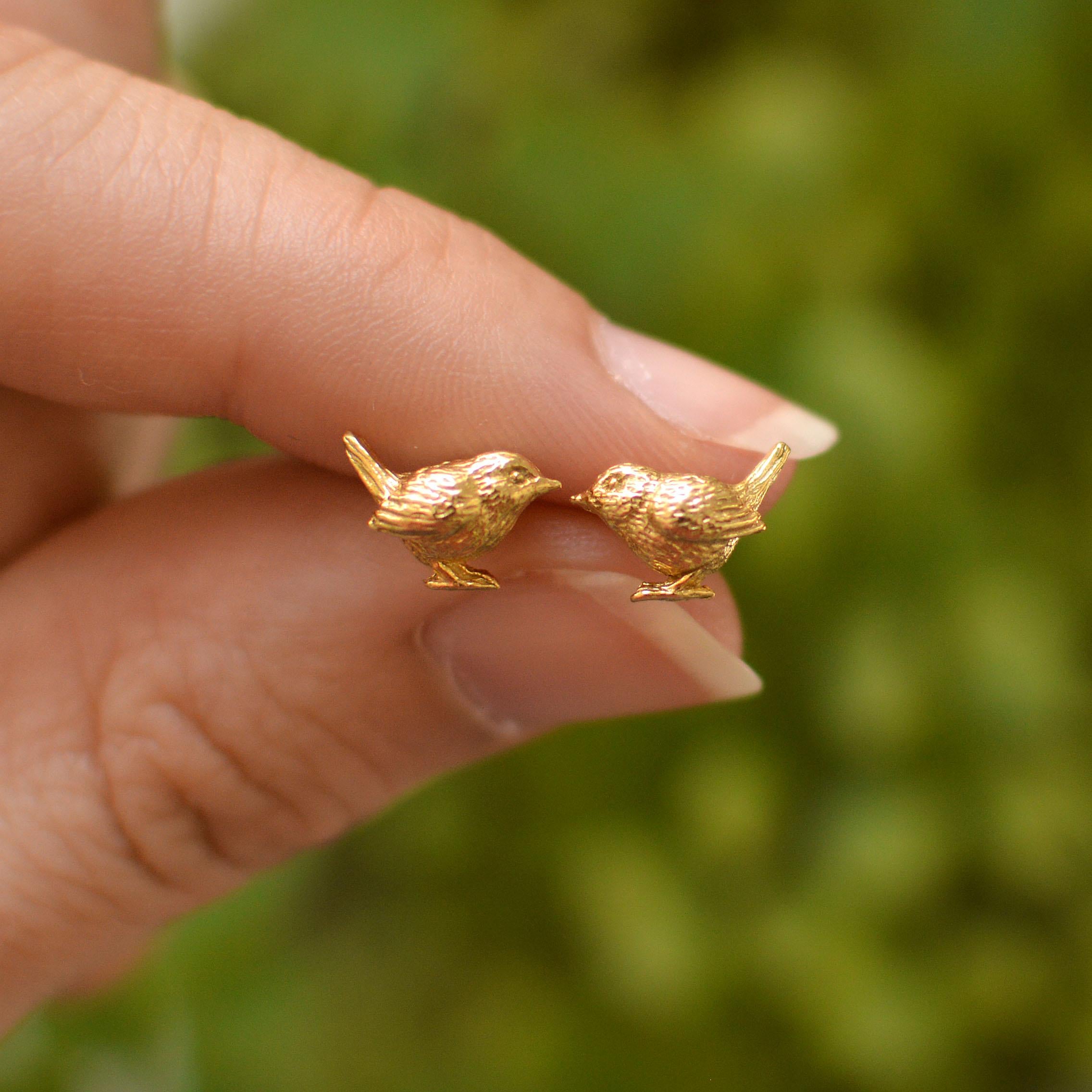 These adorably tiny wren stud earrings are cast in solid 18 Carat gold and finished by hand, and created from Lucy's original hand-sculpted design. 

These wren earrings are made in London, United Kingdom using recycled or Fairtrade Gold. Metals are