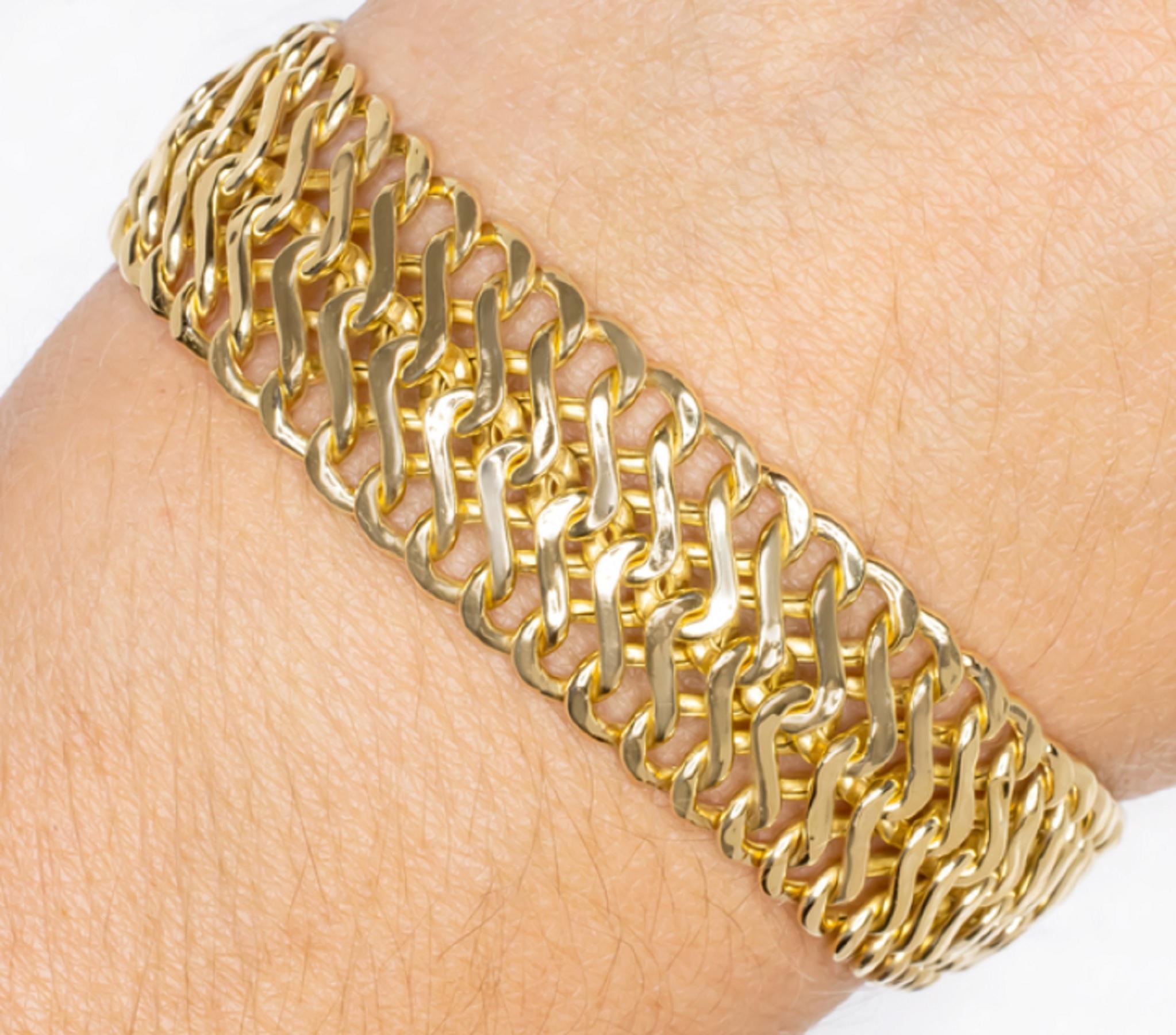Solid 18k yellow gold double row chain bracelet has a sturdy look and feel. Crafted in Italy, this bracelet is very high quality and has a luxurious look and feel. This chain is made of solid 18k yellow gold, unlike the many plated or hollow link