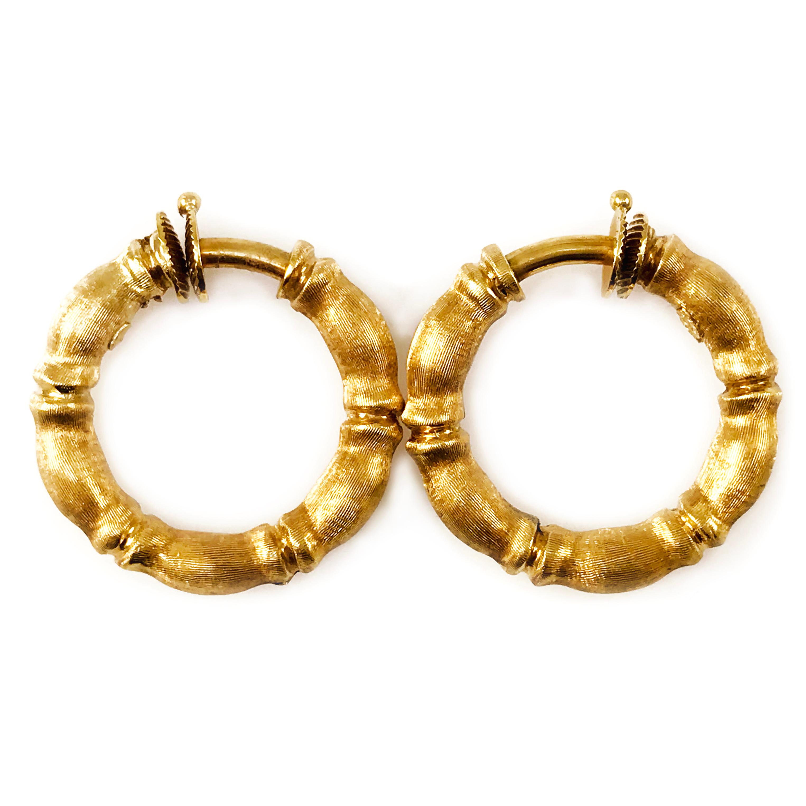 Solid 18 Karat Bamboo Gold Hoop Earrings with a brushed satin finish. These unique earrings are not for pierced ears as they have no post and springs closure clip. The total gold weight of these earrings is 13.8 grams.