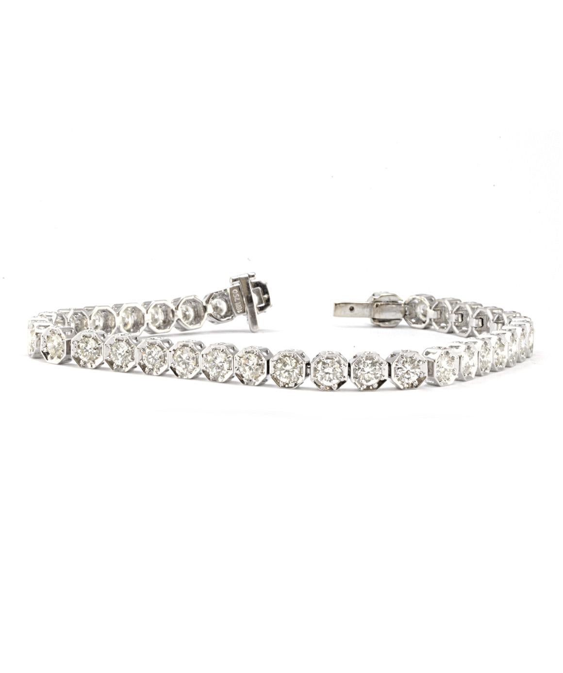 This solid 18k white gold diamond tennis bracelet is in excellent condition! There are 35 diamonds weighing 3.50CTTW I/SI approximately. Each diamond is set in a octagon shape setting. The bracelet measures 7 inches and weighs 15.1 grams