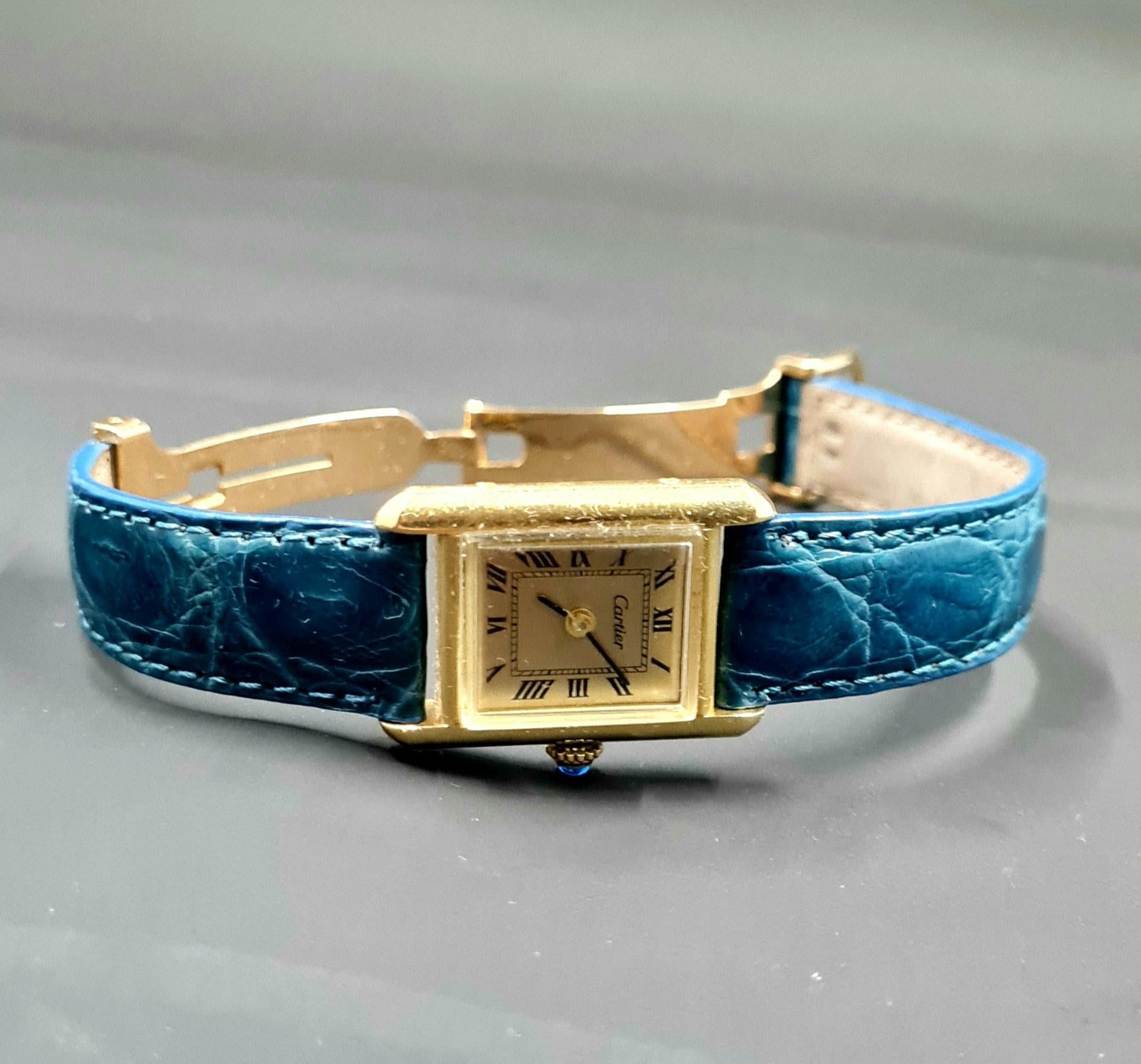This watch was just serviced and running well. The watch is 20mm by 29mm and is a unisex watch, but is more suited for a ladies. The watch is all genuine Cartier, with an original Cartier movement, crown, stem, and case. The case is solid 18k gold