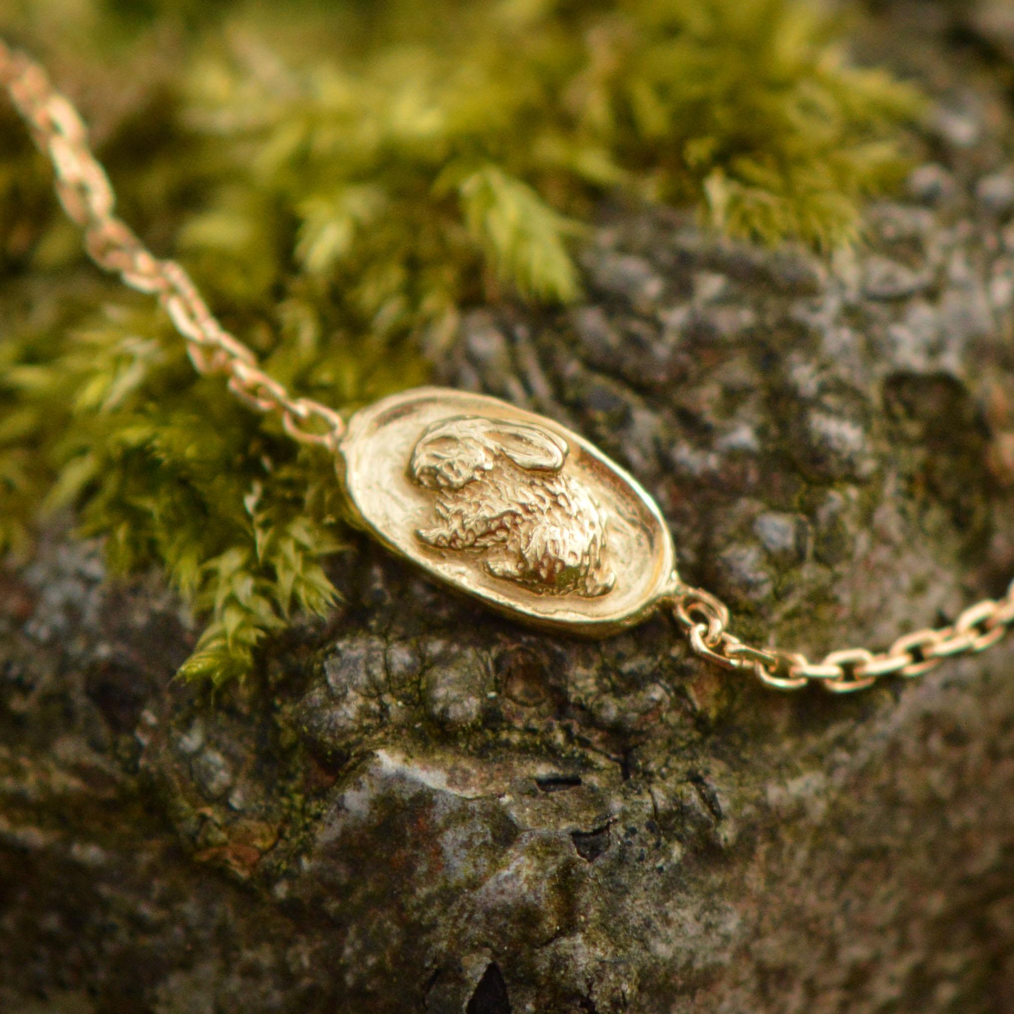 This dainty little bracelet features a tiny sleeping rabbit. It is cast in solid 18 Carat gold and finished by hand, and is created from Lucy's original hand-sculpted design. 

This bracelet is made in London, United Kingdom using recycled or