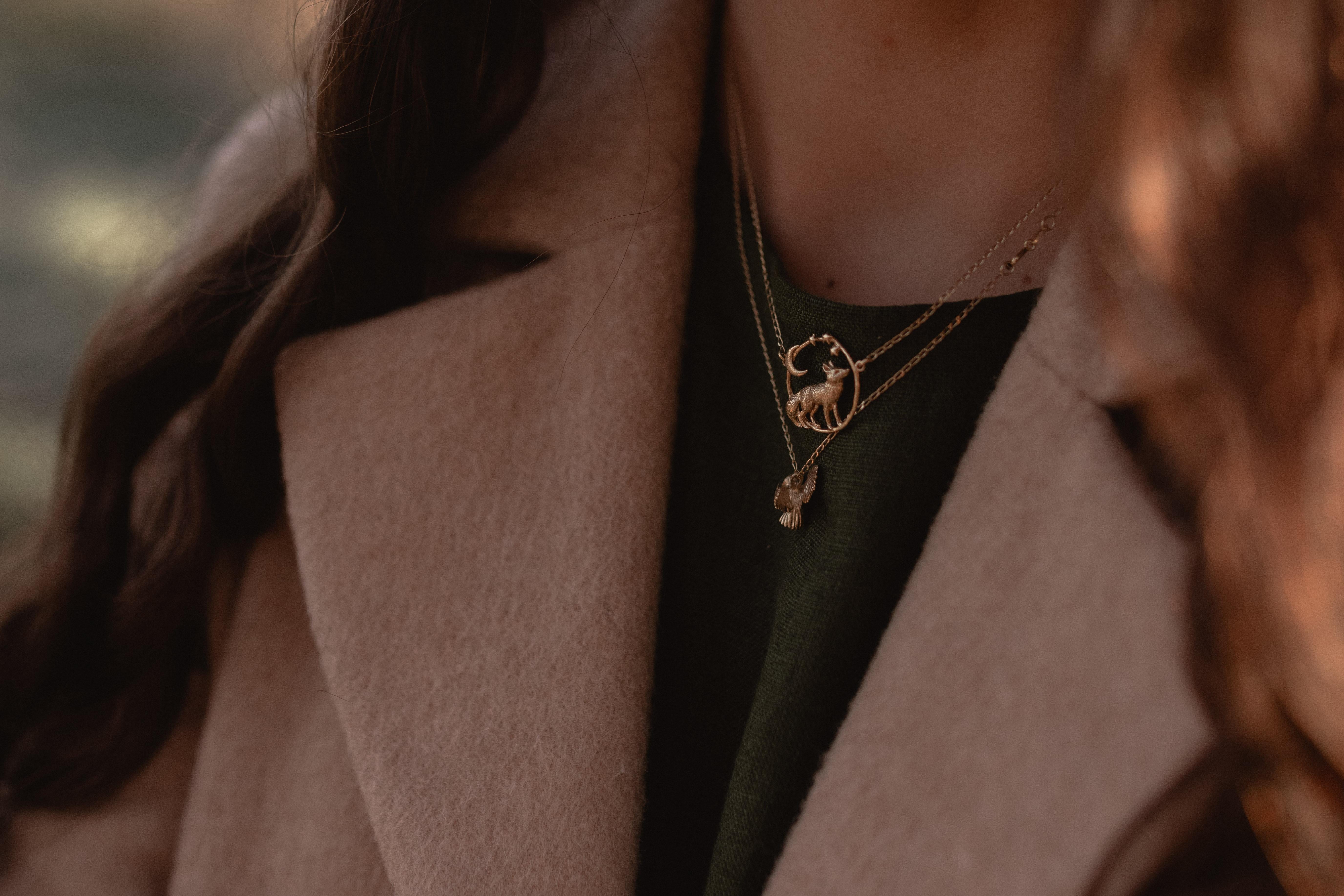 This dreamy fox necklace is cast in solid 18 Carat gold and finished by hand, and is created from Lucy's original hand-sculpted design. 

This stargazing fox pendant is made in London, United Kingdom using recycled or fairtrade Gold. Metals are