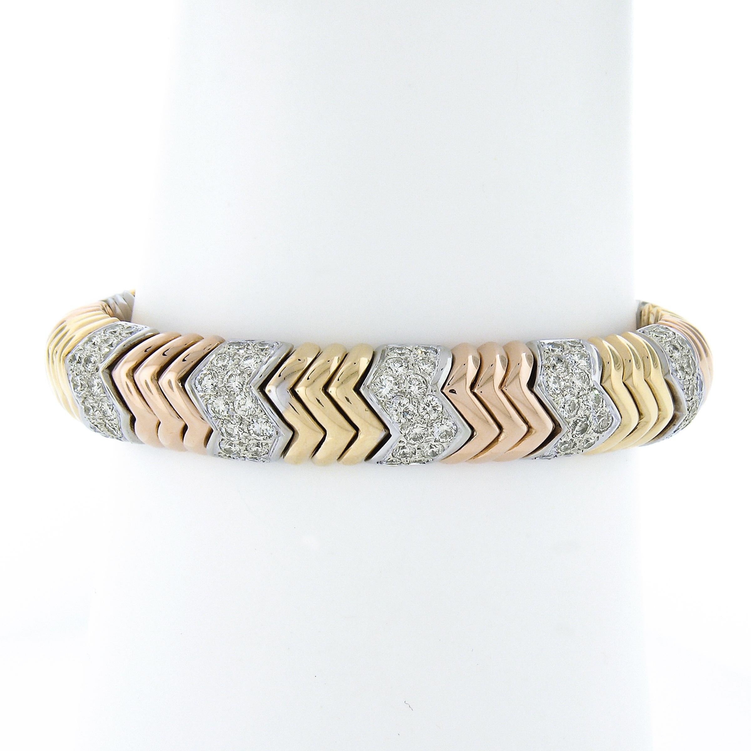 This stunner of a diamond cuff bracelet is assembled from solid 18k yellow, rose and white gold flexible chevron links. It is also adorned with chevron shaped pave set diamond links that add some fabulous bright and fiery effects with a total of
