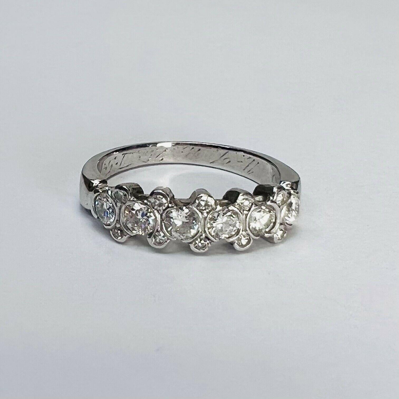 Presenting A:

Solid 18K White Gold 0.88CTW European Cut Diamonds Ring Band Size 5.5

The ring has diamonds layered in a row.

The Diamonds are natural and earth mined.

The ring is 4.5mm wide, 2mm rise and 2mm shank.

The Ring is 5mm wide, 2mm rise