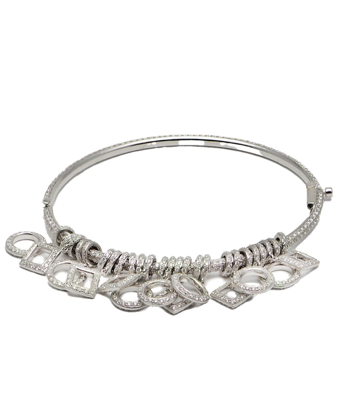 Solid 18K White Gold Diamond Charm Bangle Bracelet 7.73CTTW, 21.9 Grams
This beautiful bracelet is in excellent condition. There are a total of (13) Charms, (7) of them are round and (6) of them are square and there are (12) spacers between the