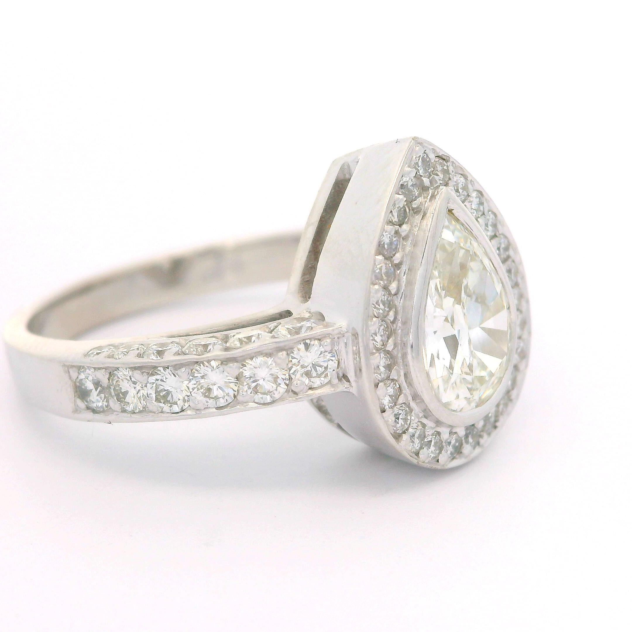 --Stone(s):--
(1) Natural Genuine Diamond - Pear Brilliant Cut - Bezel Set - H Color - IF Clarity - 1.09ct (exact - certified)
** See Certification Details Below for Complete Info **
(62) Natural Genuine Diamonds - Round Brilliant Cut - Pave Set -