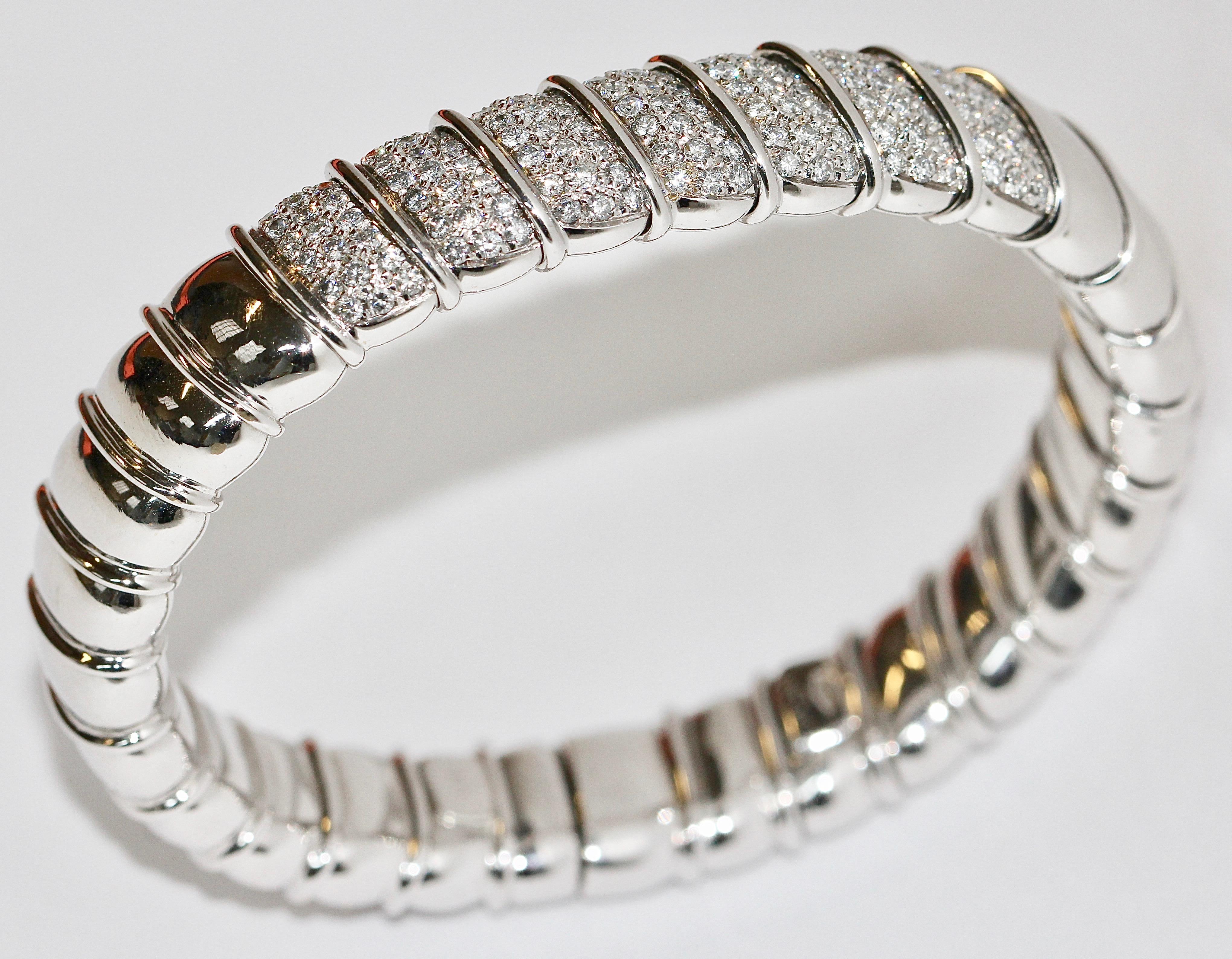 High-quality, solid luxury bangle, 18k white gold, set with diamonds.
