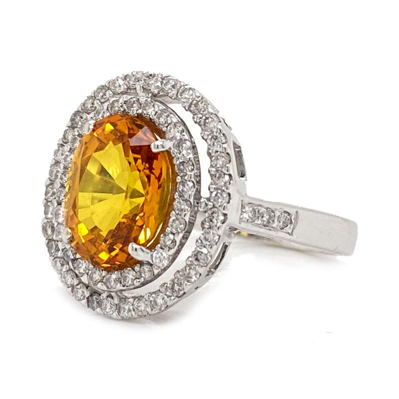 Solid 18K White Gold Natural Yellow Sapphire & Genuine Diamond Halo Ring 5.4g
Excellent condition. This solid 18K white gold ring features an oval natural yellow sapphire that measures approximately 9.55mm X 7.45mm. It is surrounded by two halo's