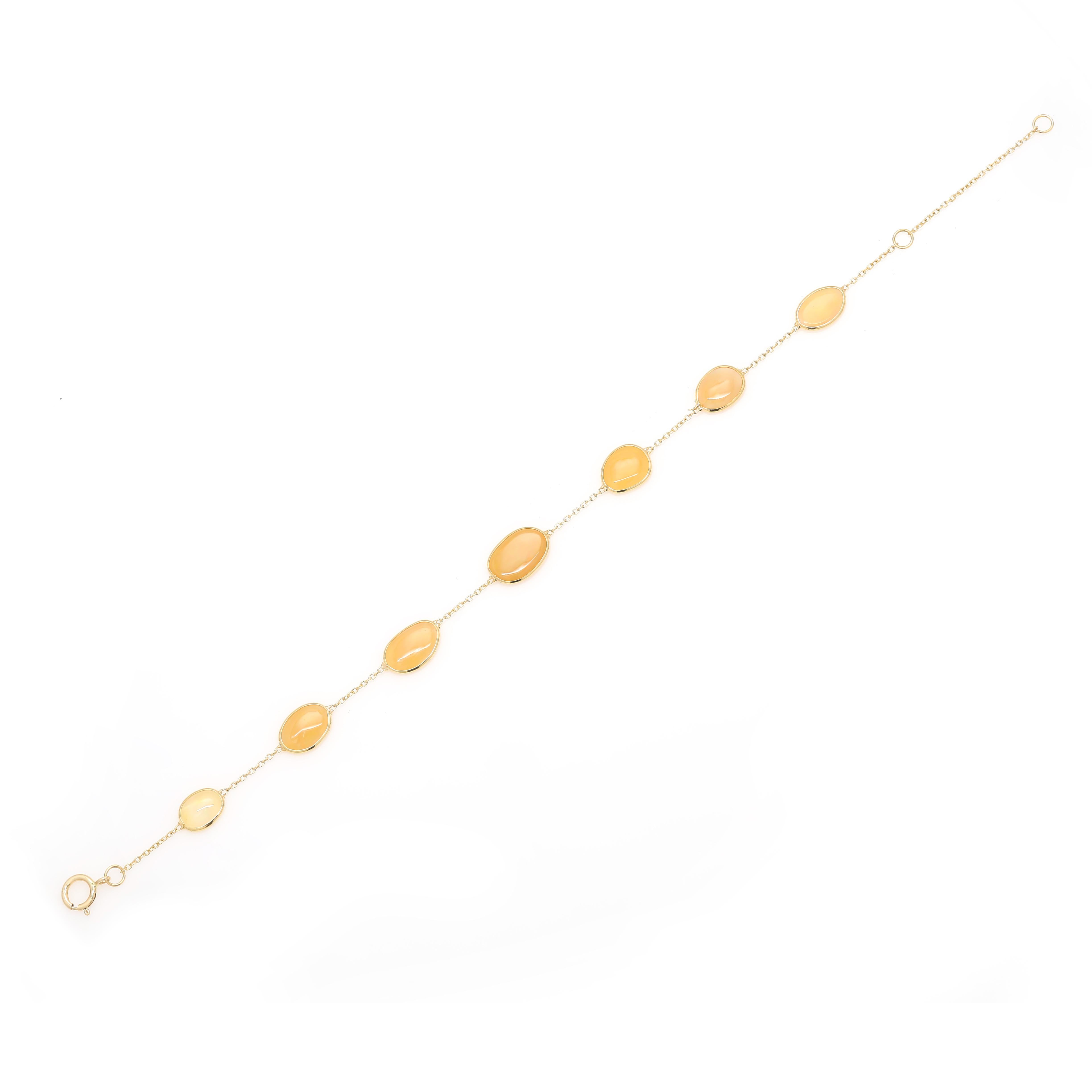 This Beautiful Opal Station Chain Bracelet in 18K gold showcases 7 sparkling natural opal, weighing 3.5 carat. It measures 6 inches long in length. 
Opal enhances creativity, passion and strength.
Designed with uneven cut opal linked with chain to