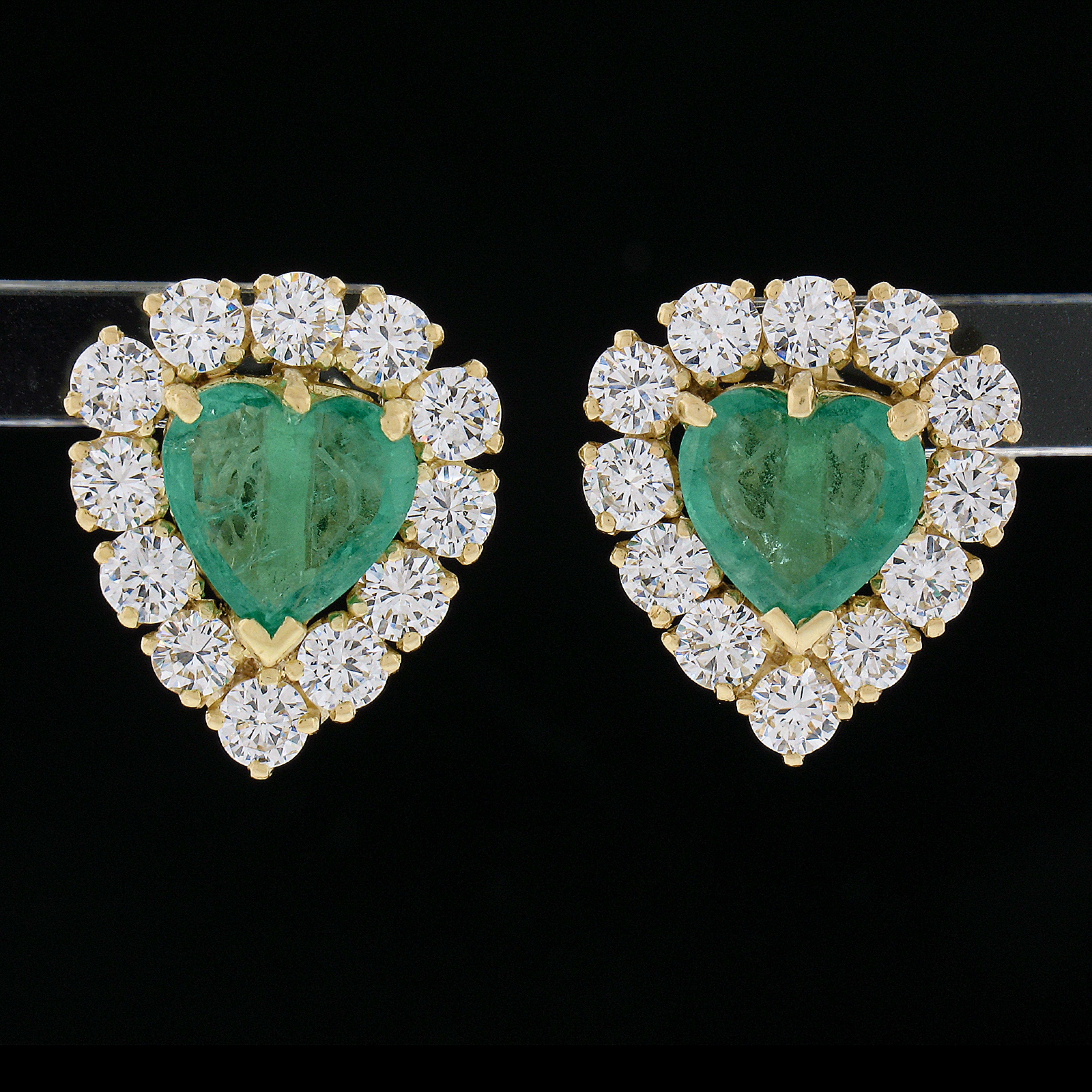 --Stone(s):--
(2) Natural Genuine Emeralds - Heart Brilliant Cut - Prong Set - Nice Match Vivid Green Color - 7.1-7.3x7mm - 1.50-1.80ctw (approx.)
(24) Natural Genuine Diamonds - Round Brilliant Cut - Prong Set - F/G Color - VS1/VS2 Clarity -