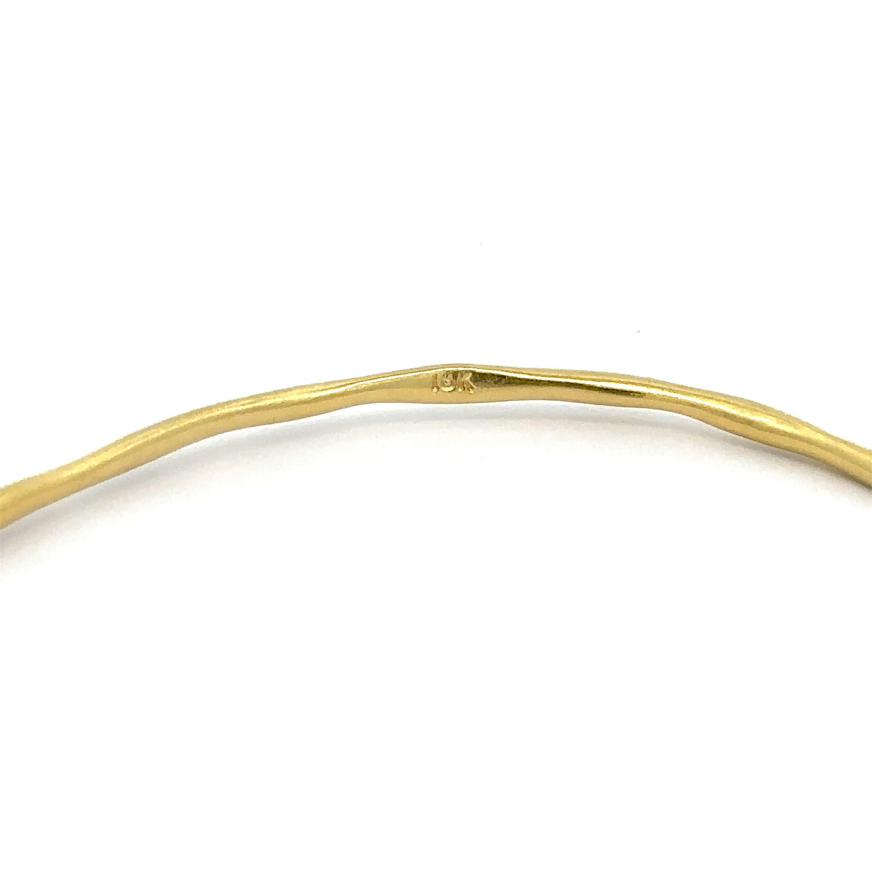 Material: Solid 18k Yellow Gold
Weight: 9.08 Grams
Type: Slip On bangle 
Overall Length: Will comfortably fit up to 7.25” (measured on wrist)
Overall Width: 62.6mm (2.4