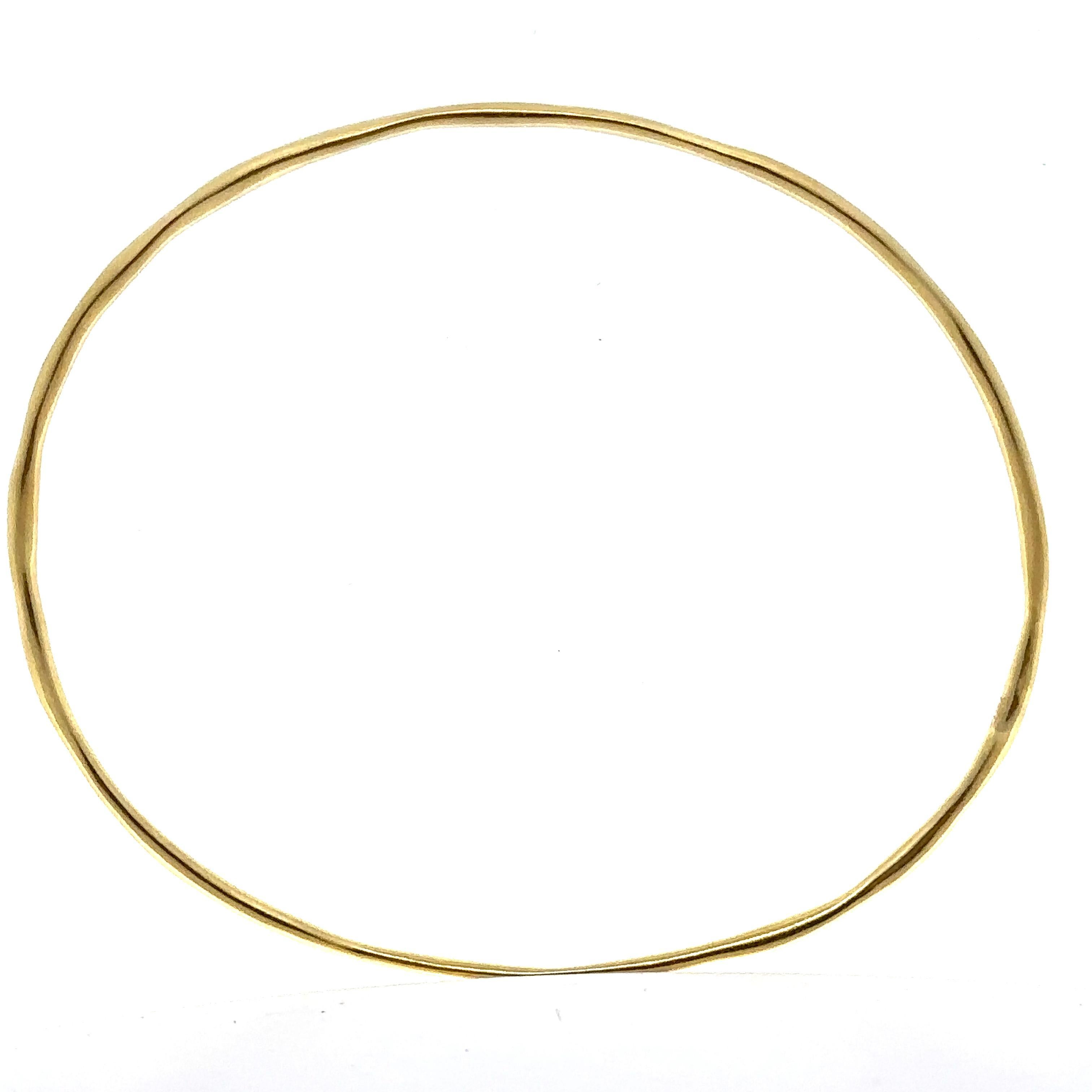 Material: Solid 18k Yellow Gold
Weight: 7.58 Grams
Type: Slip On bangle 
Overall Length: Will comfortably fit up to 7.75” (measured on wrist)
Overall Width: 68mm (2.6