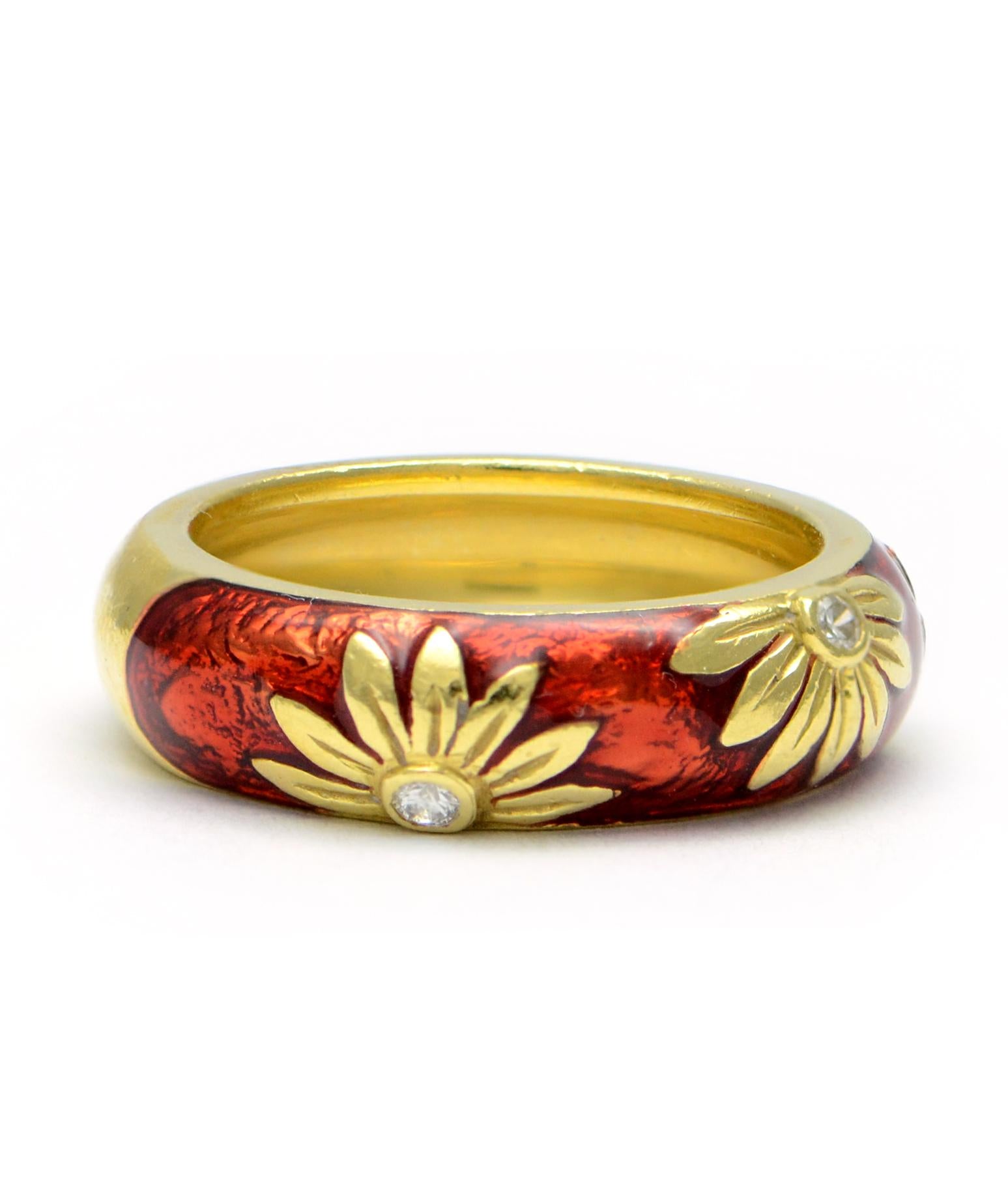 Excellent condition. This solid 18k yellow gold ring features gorgeous red enamel and 3 flowers, each centered with a genuine round diamond. This band measures approximately 5.65mm wide and is a size 5.25. It weighs 7.6 grams.