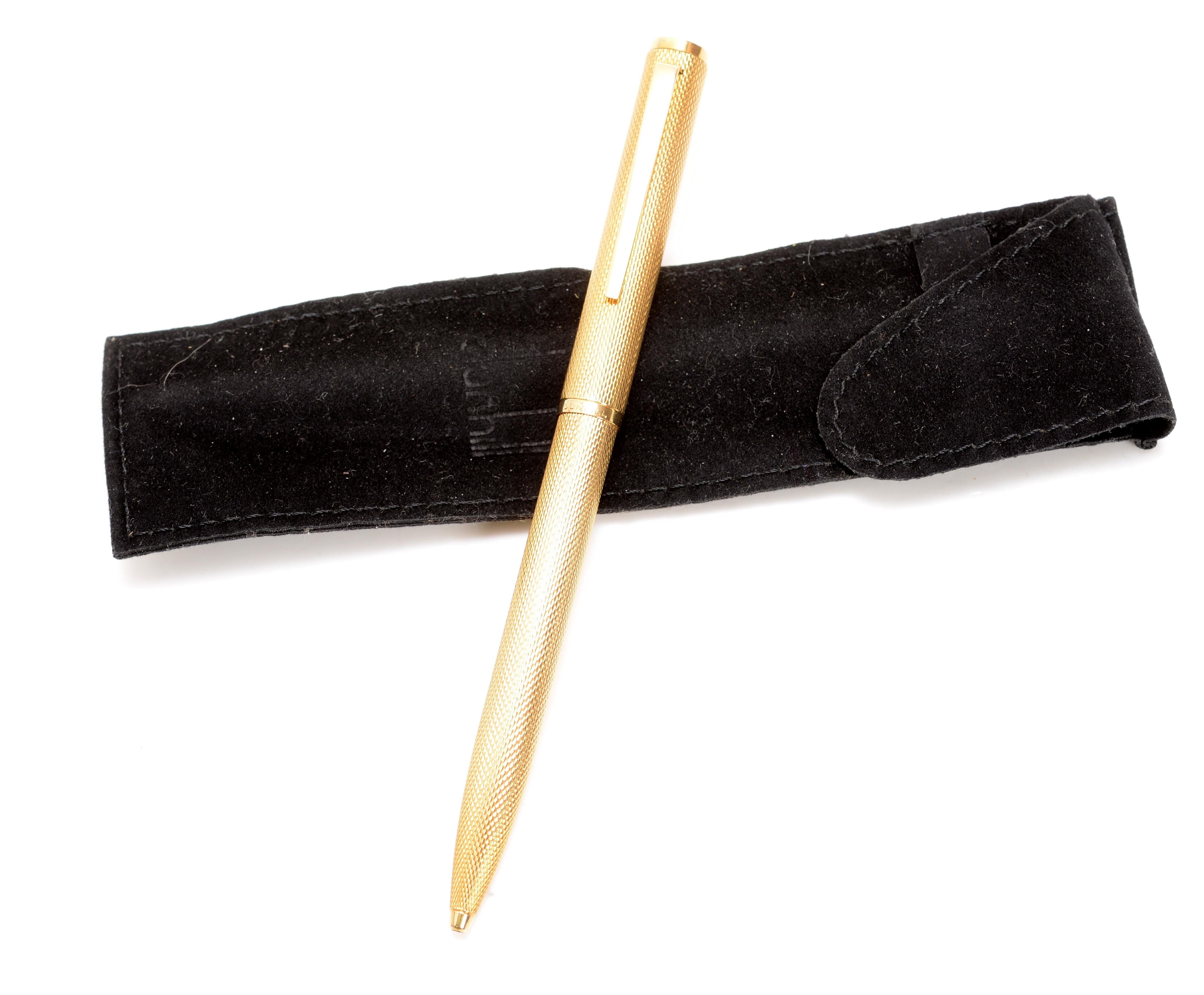 Solid 18kt Yellow Gold Dunhill Ballpoint Pen, with a rich patina. This was special order, and is important and rare in solid 18kt gold. The pen's engraving is the classic barley corn decoration. Very few of these pens were made in France. Both of
