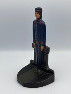 solide Art déco des années 1920 Judd Co. Butoir de porte Bellhop en fonte bleue