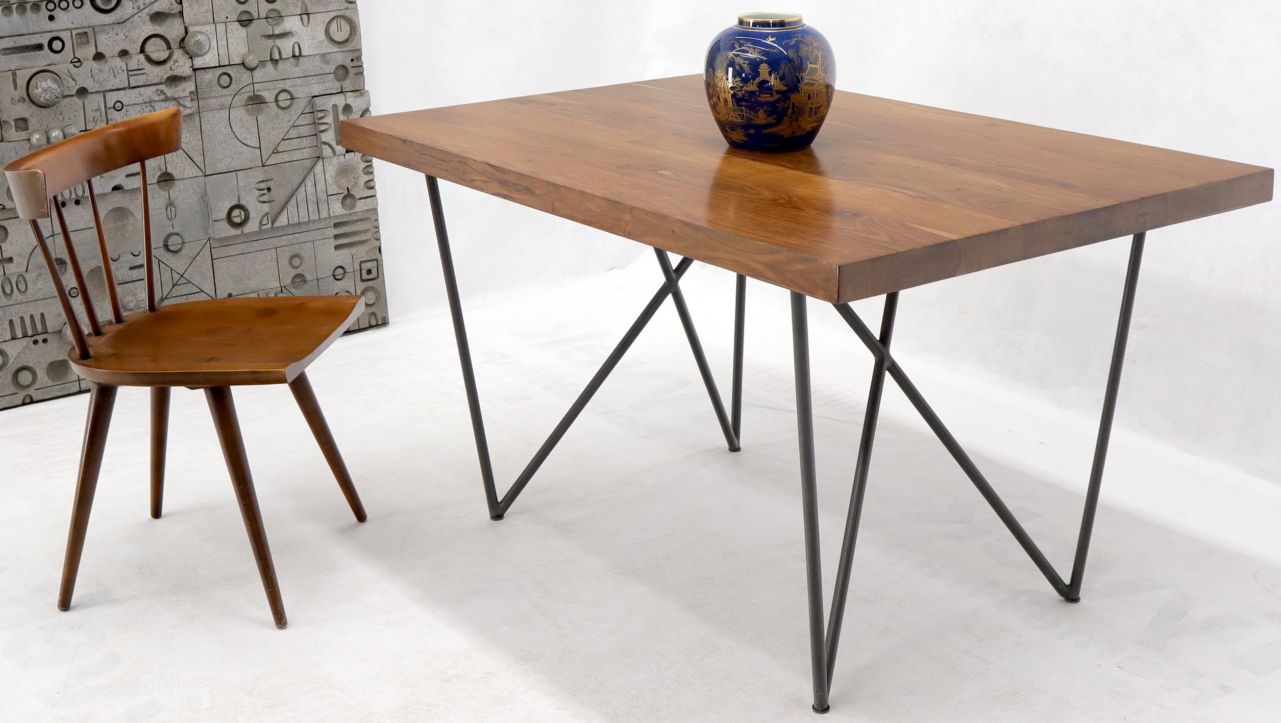 Mid-Century Modern style thick solid teak top dining table on hairpin legs. Measure: 2