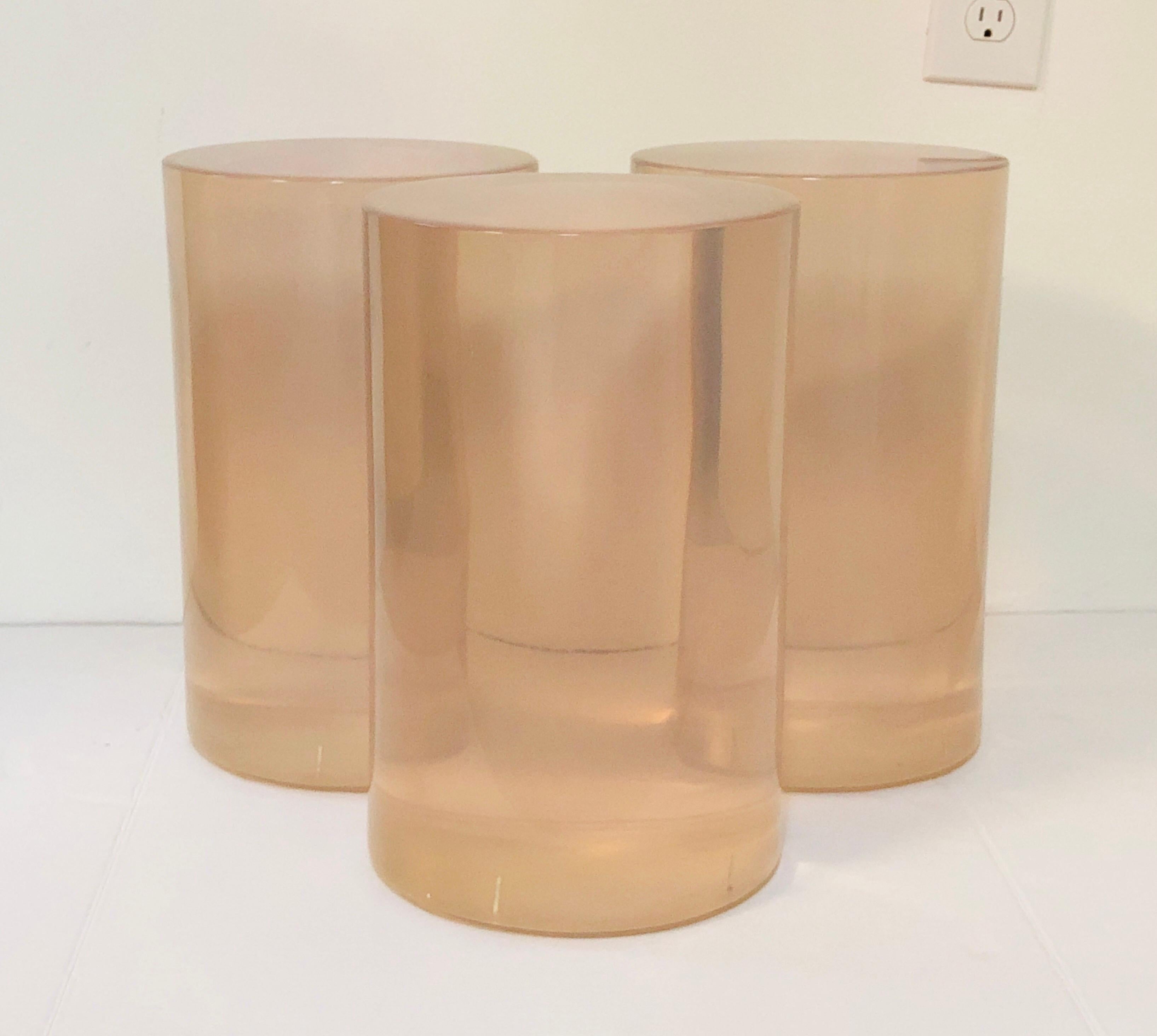 A solid acrylic resin drink or side table. Each one is 9
