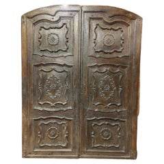 Solid and baroque double-leaf walnut entrance door, Italy
