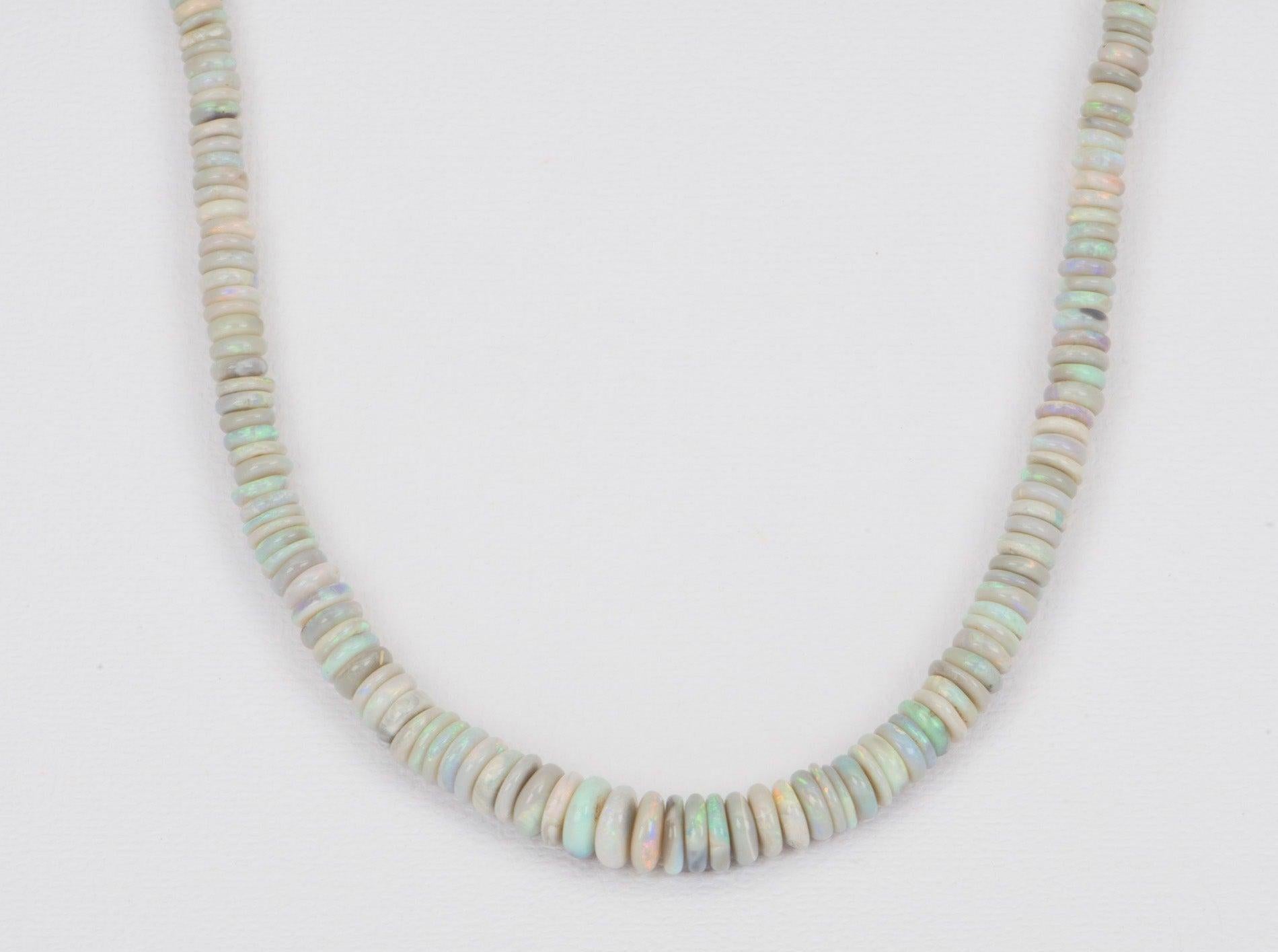 ♥ Solid Australian black Opal Heishi bead necklace with a 14k yellow gold push gate oval clasp
♥ The necklace measures 17